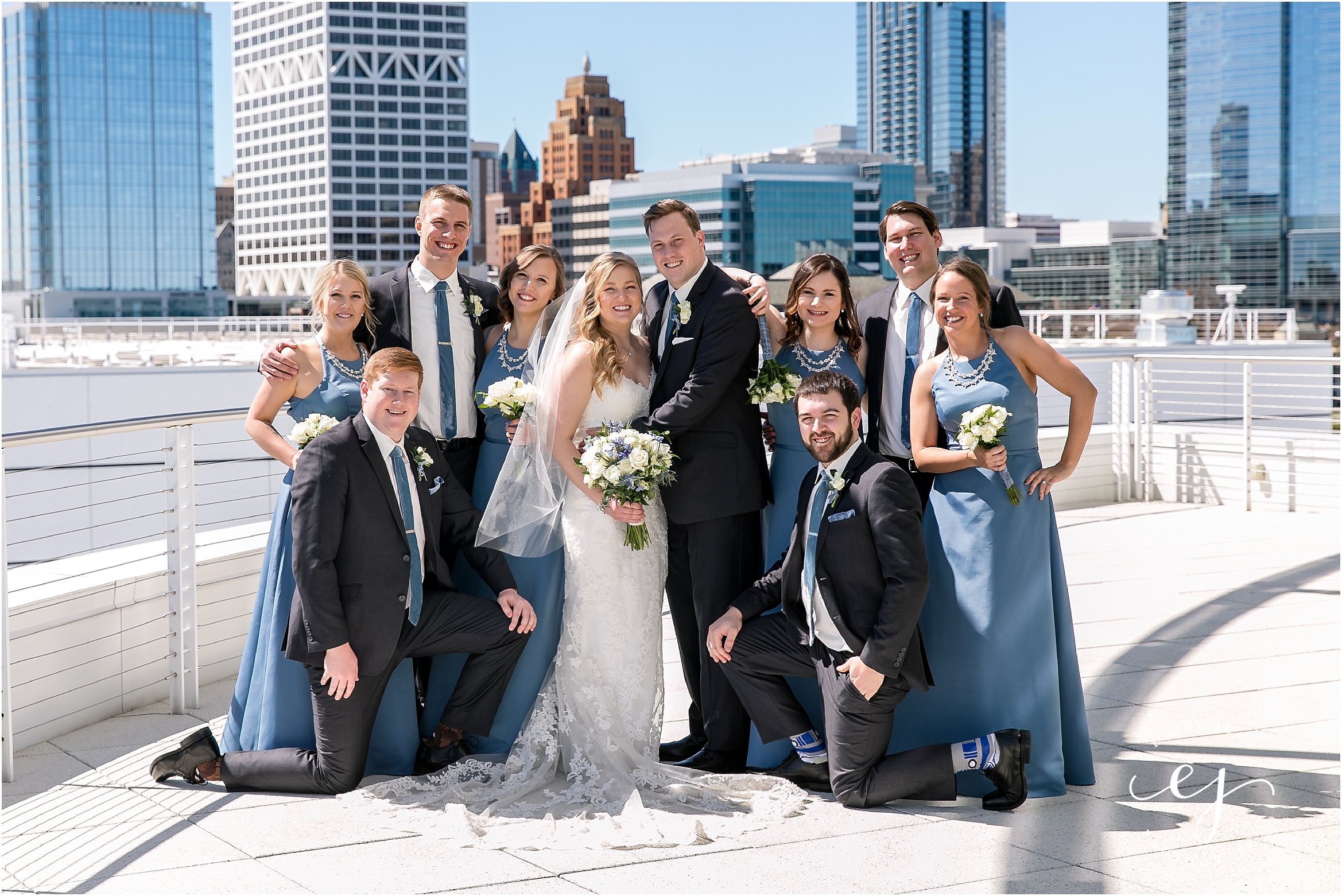 portrait of wedding party with milwaukee city in background