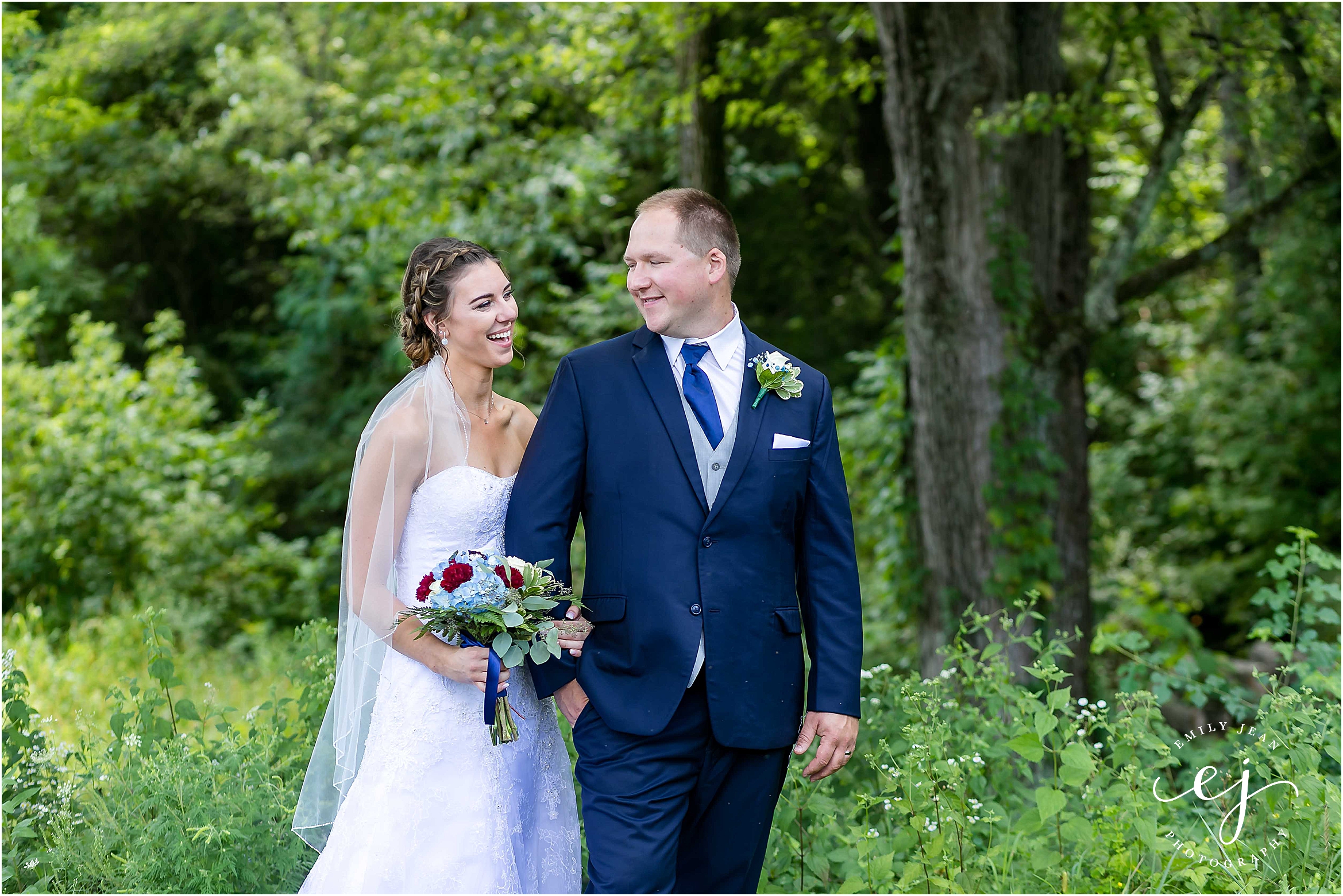 bride groom outdoors outside forest summer wedding navy suit wisconsin la crosse photographer