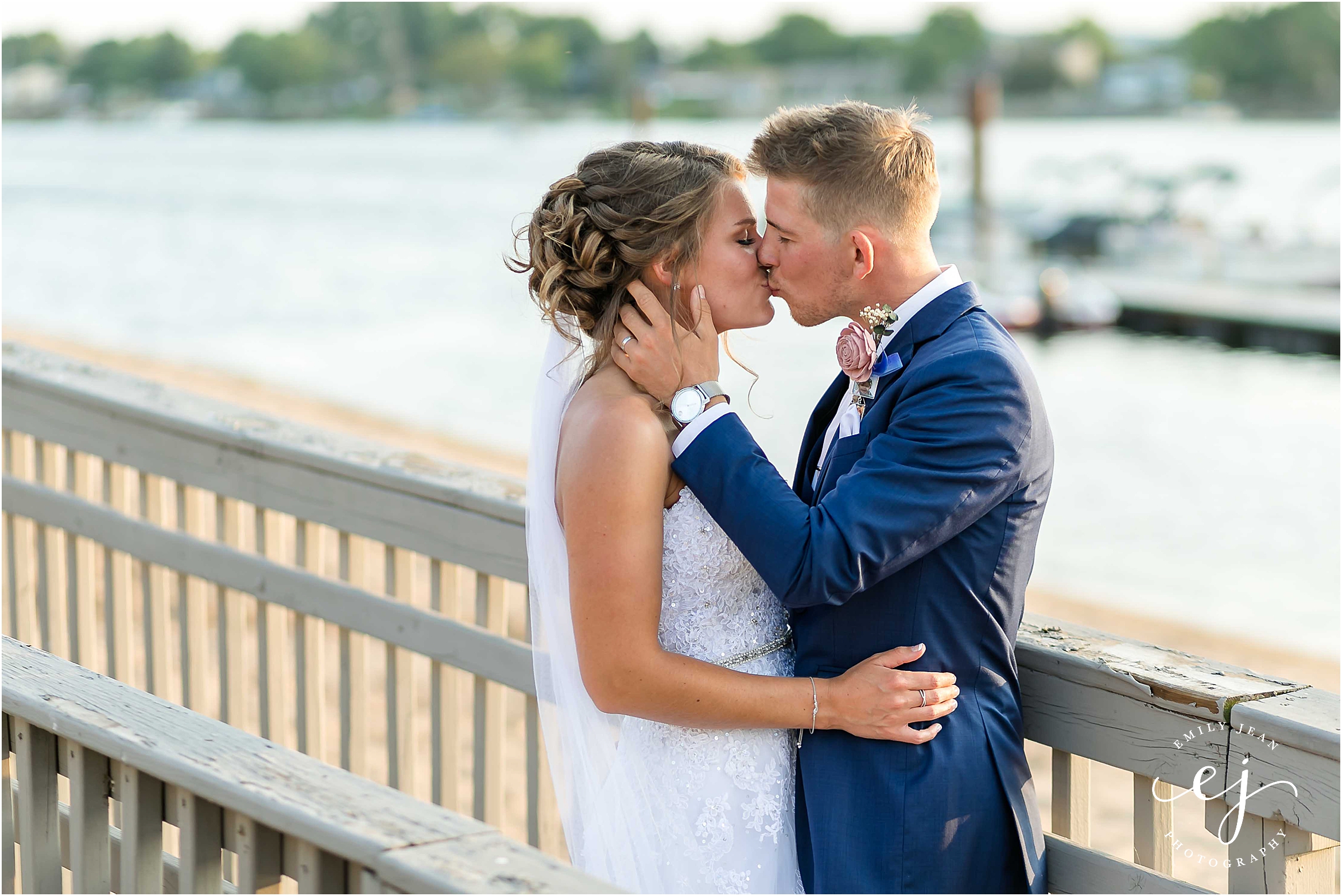 bride groom kissing wedding beach moxies americinn la crosse wedding