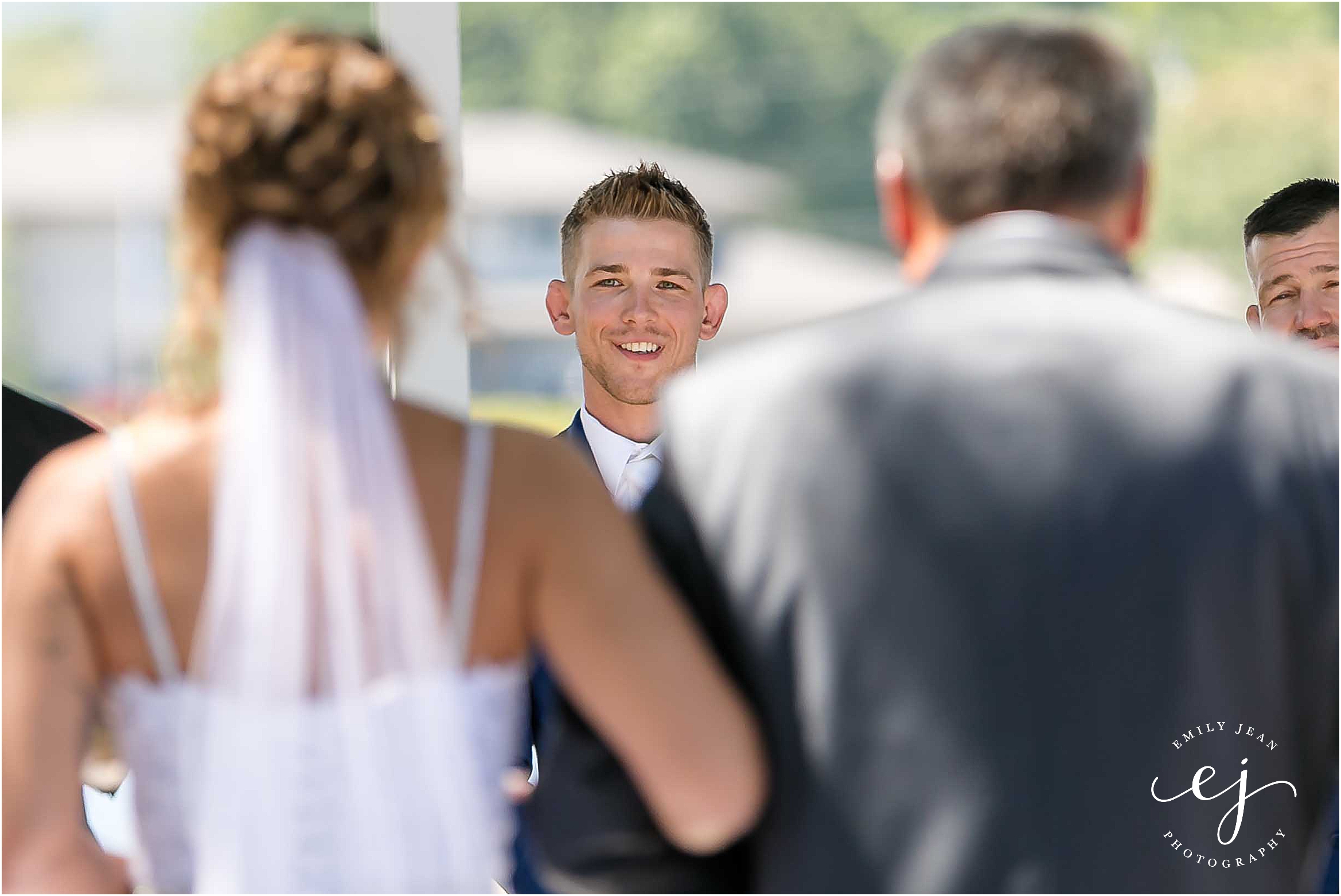 bride walking down aisle groom watching wedding photographer moxies la crosse wisconsin