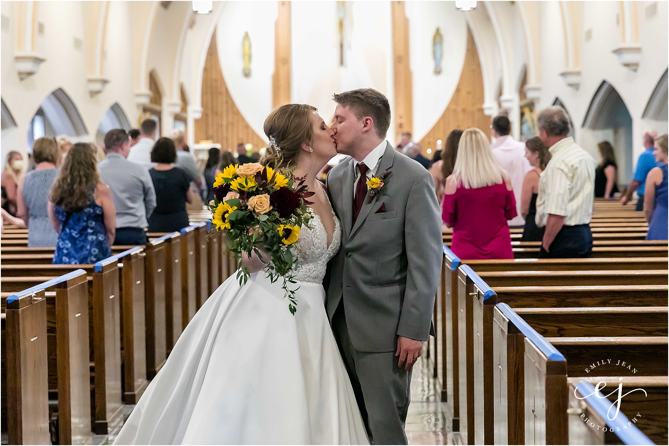 bride groom kissing blessed sacrament catholic church la crosse wisconsin