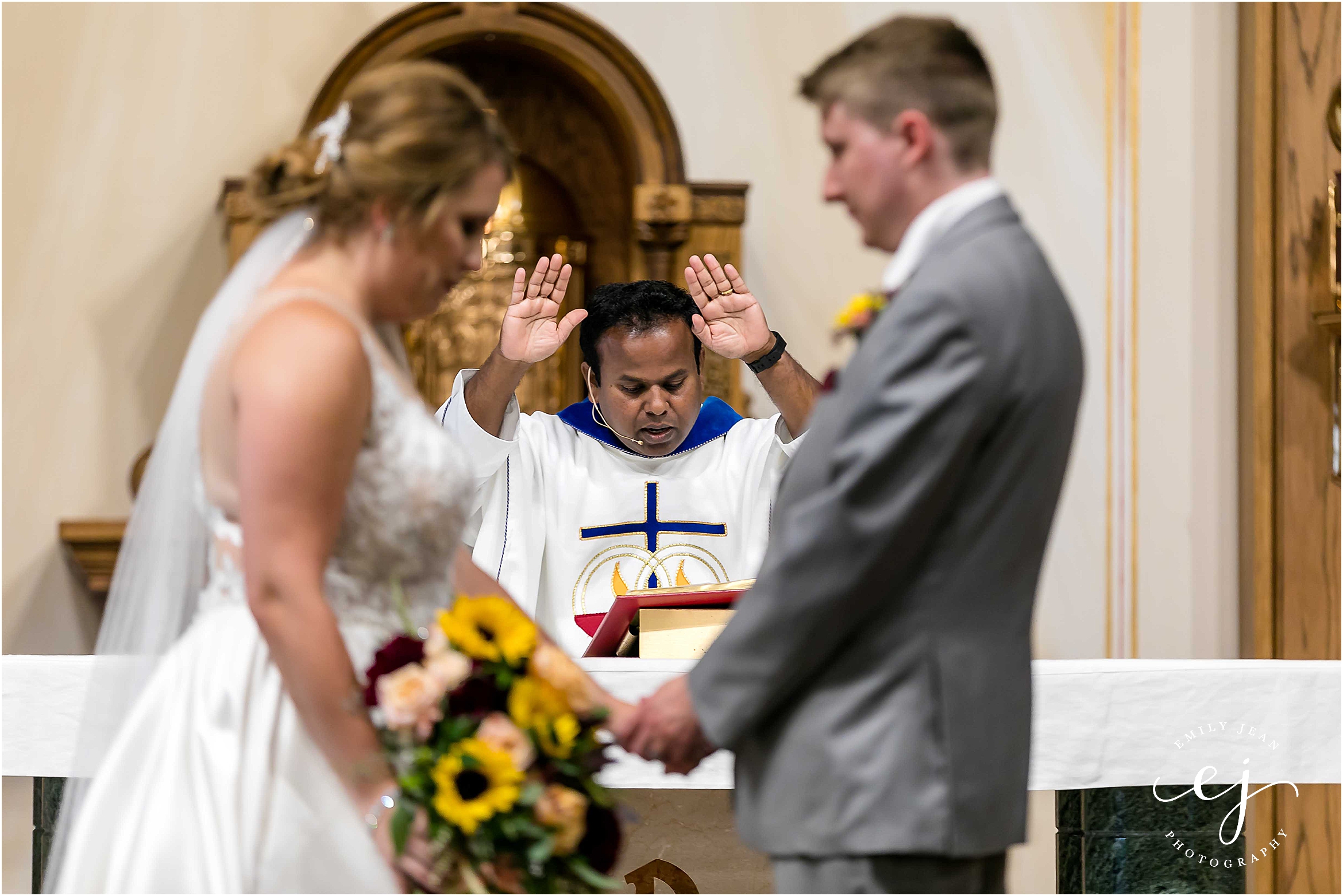 bride groom receiving blessing blessed sacrament catholic church la crosse wisconsin