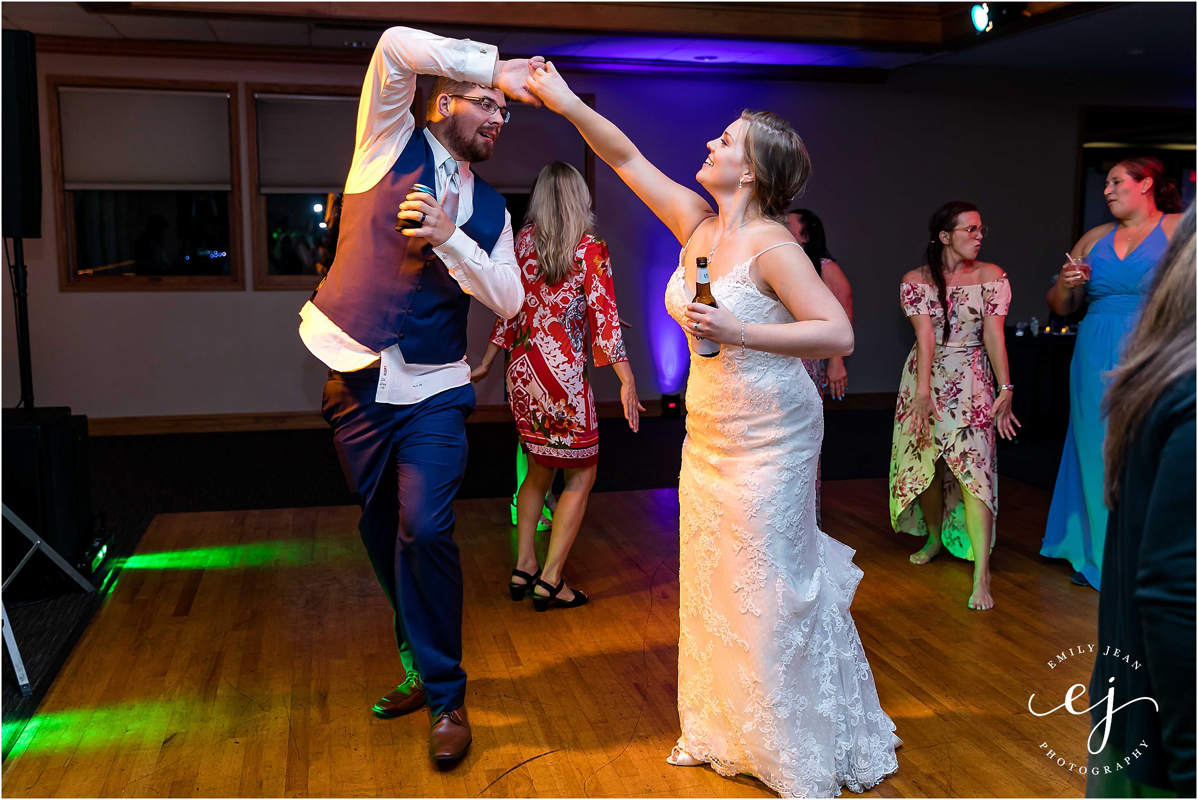 bride and groom twirling on dance floor at cedar creek