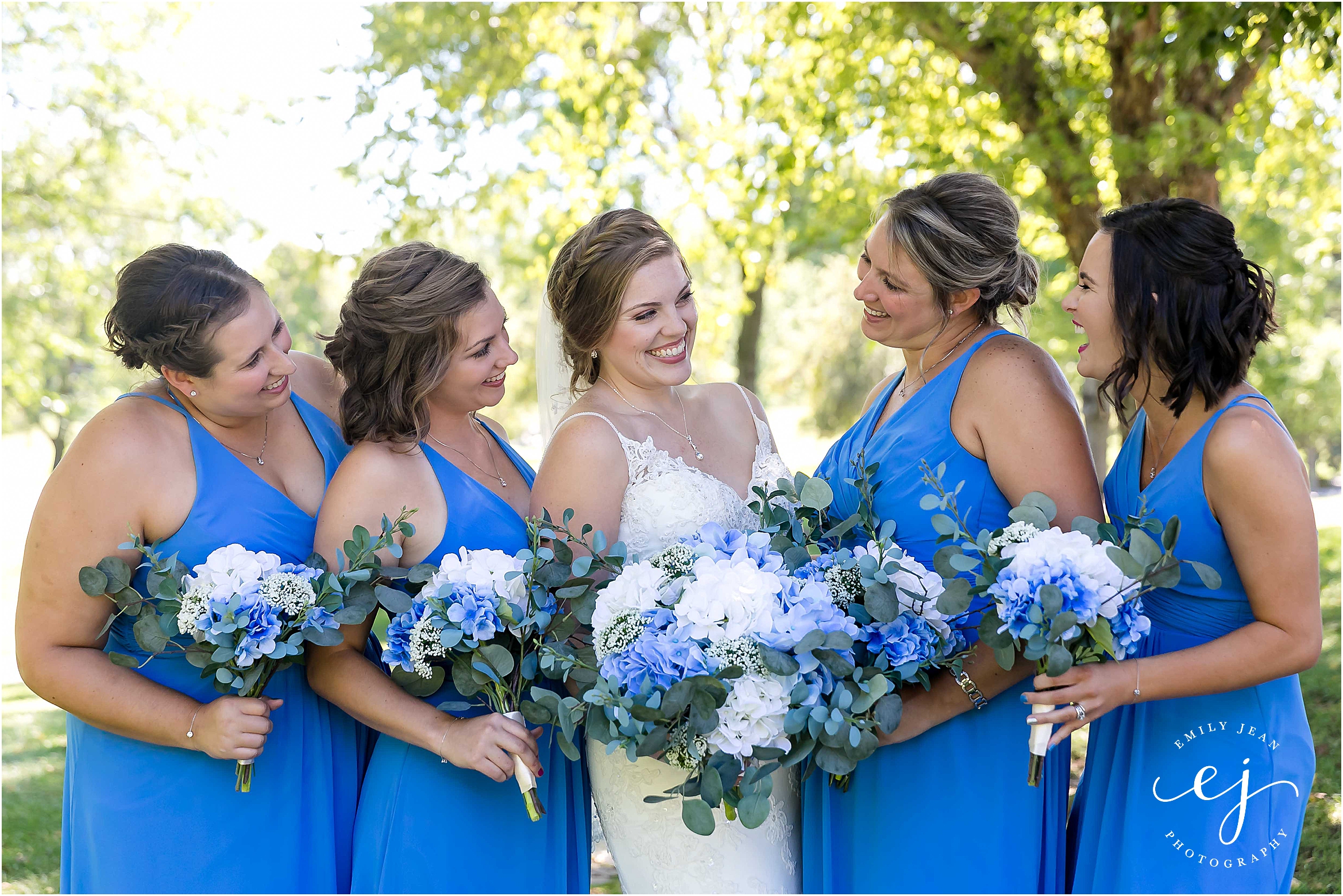 bright blue bridesmaids dresses with blue and white bouquets at cedar creek country club onalaska wisconsin