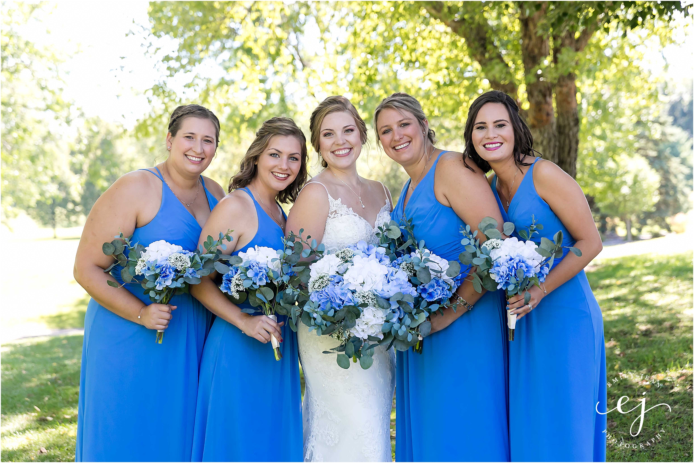 bright blue bridesmaids dresses with blue and white bouquets at cedar creek country club onalaska wisconsin