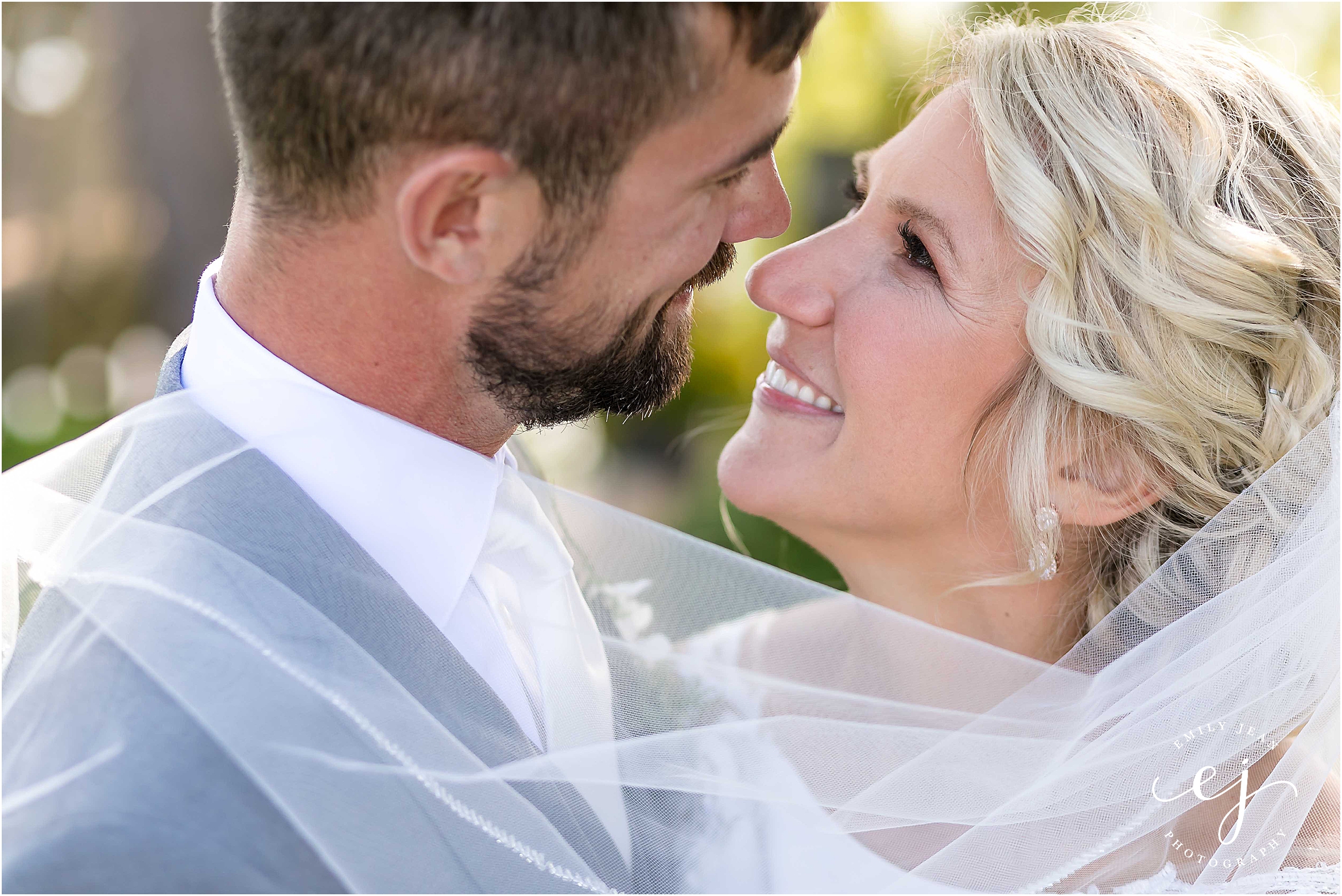 bride and groom looking at each other la crosse wisconsin wedding photographer