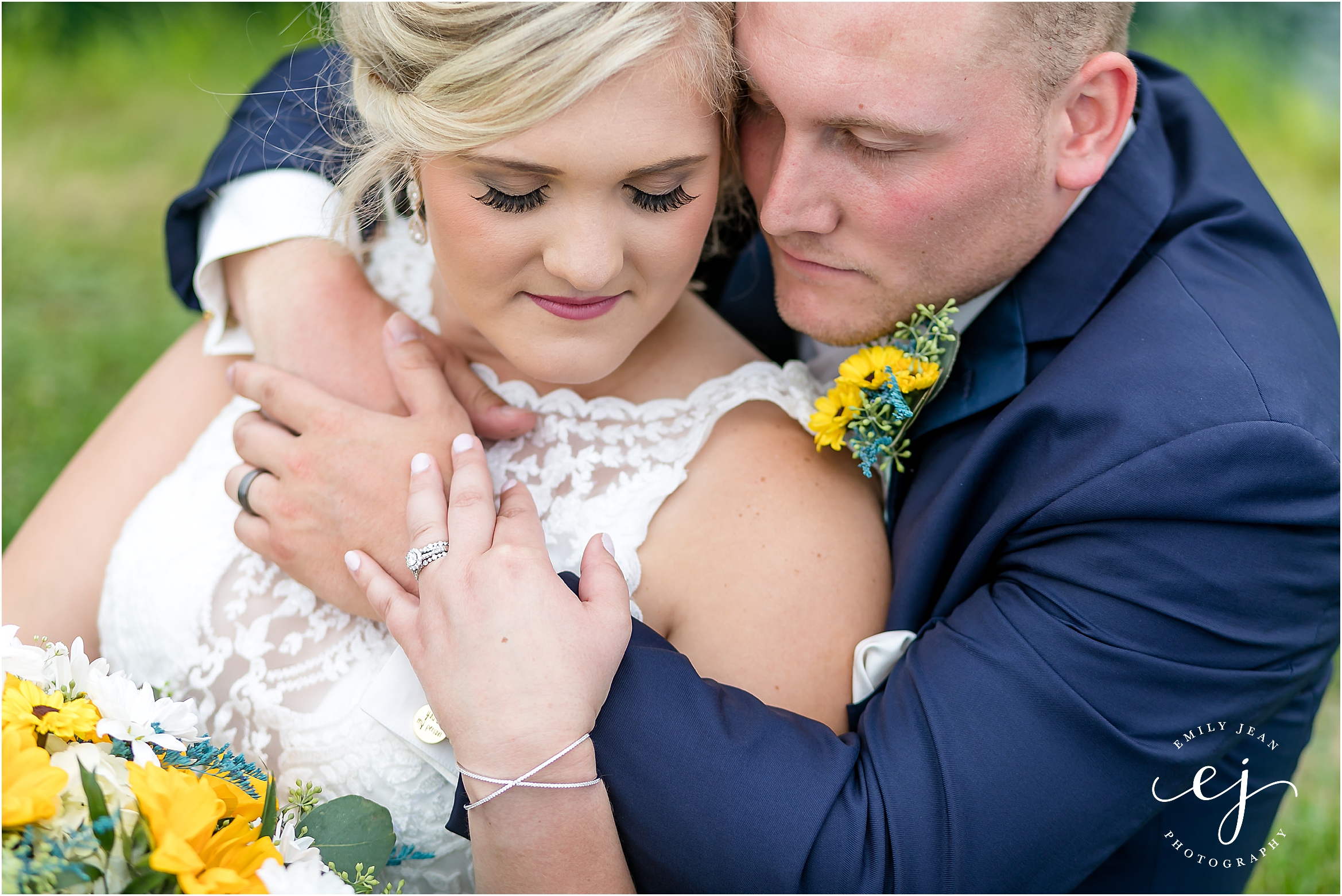 groom with navy suit bride lace dress sunflower bouquet country wedding wisconsin