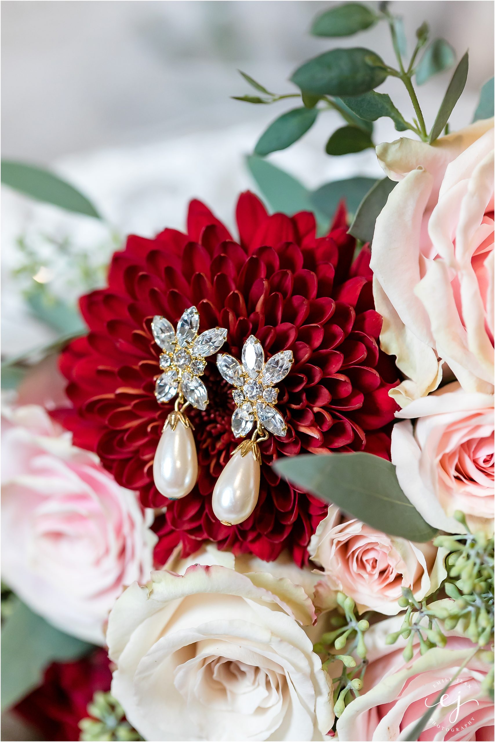 vintage sparkly and pearl earrings on floral bouquet winnebago springs minnesota wedding