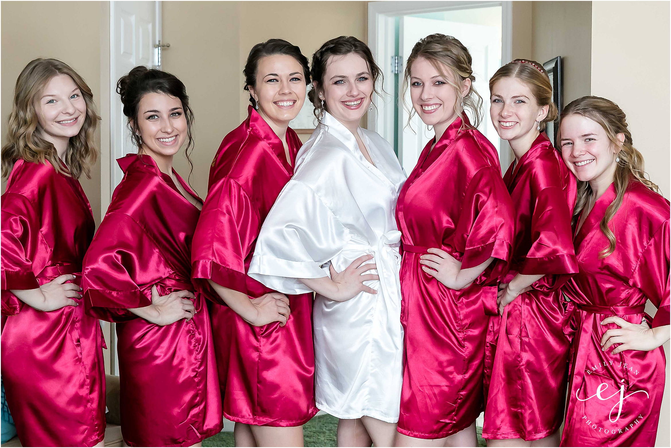 indoor getting ready bridesmaids red robes minnesota wedding