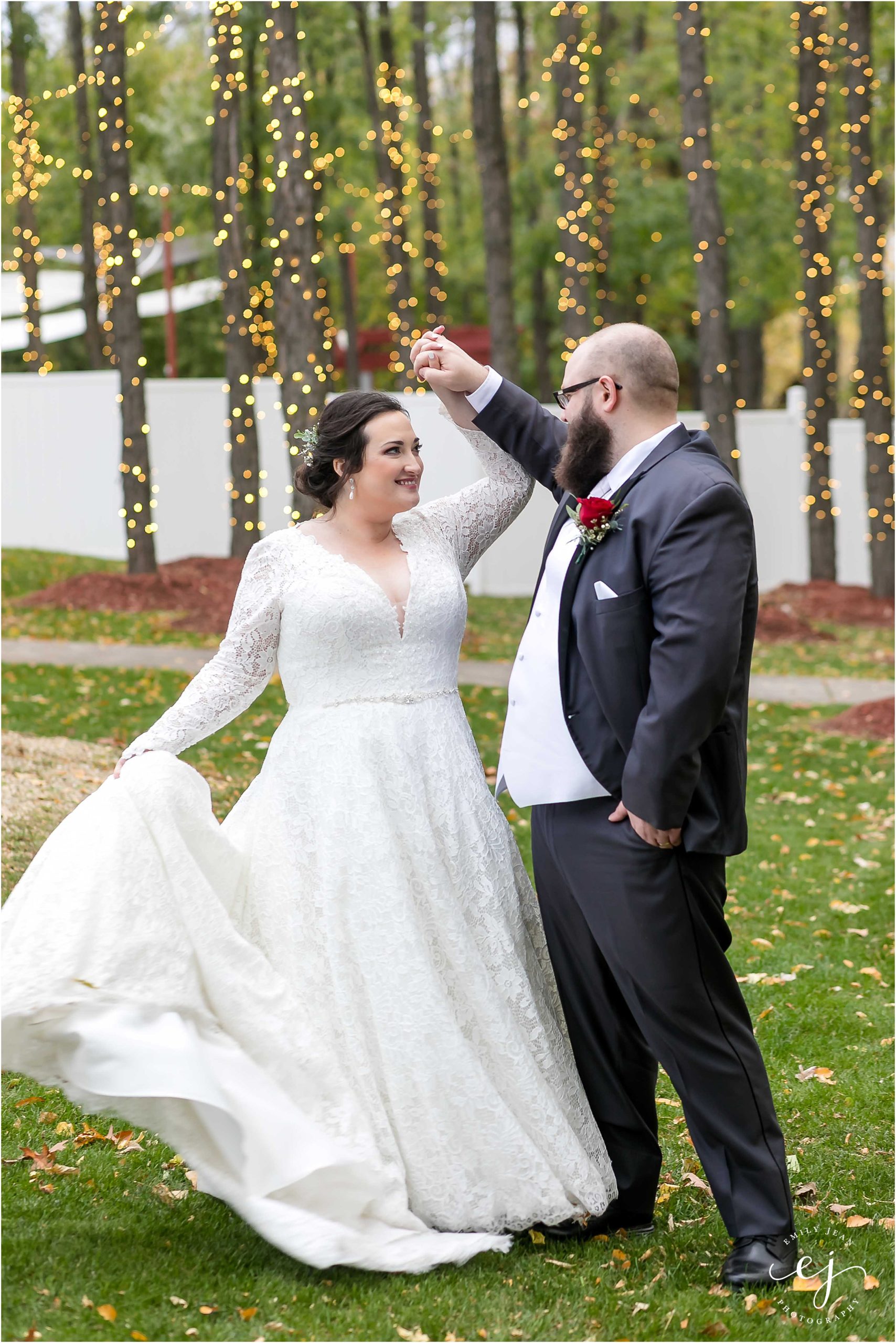 dancing in front of twinkle lights at celebrations wedding venue