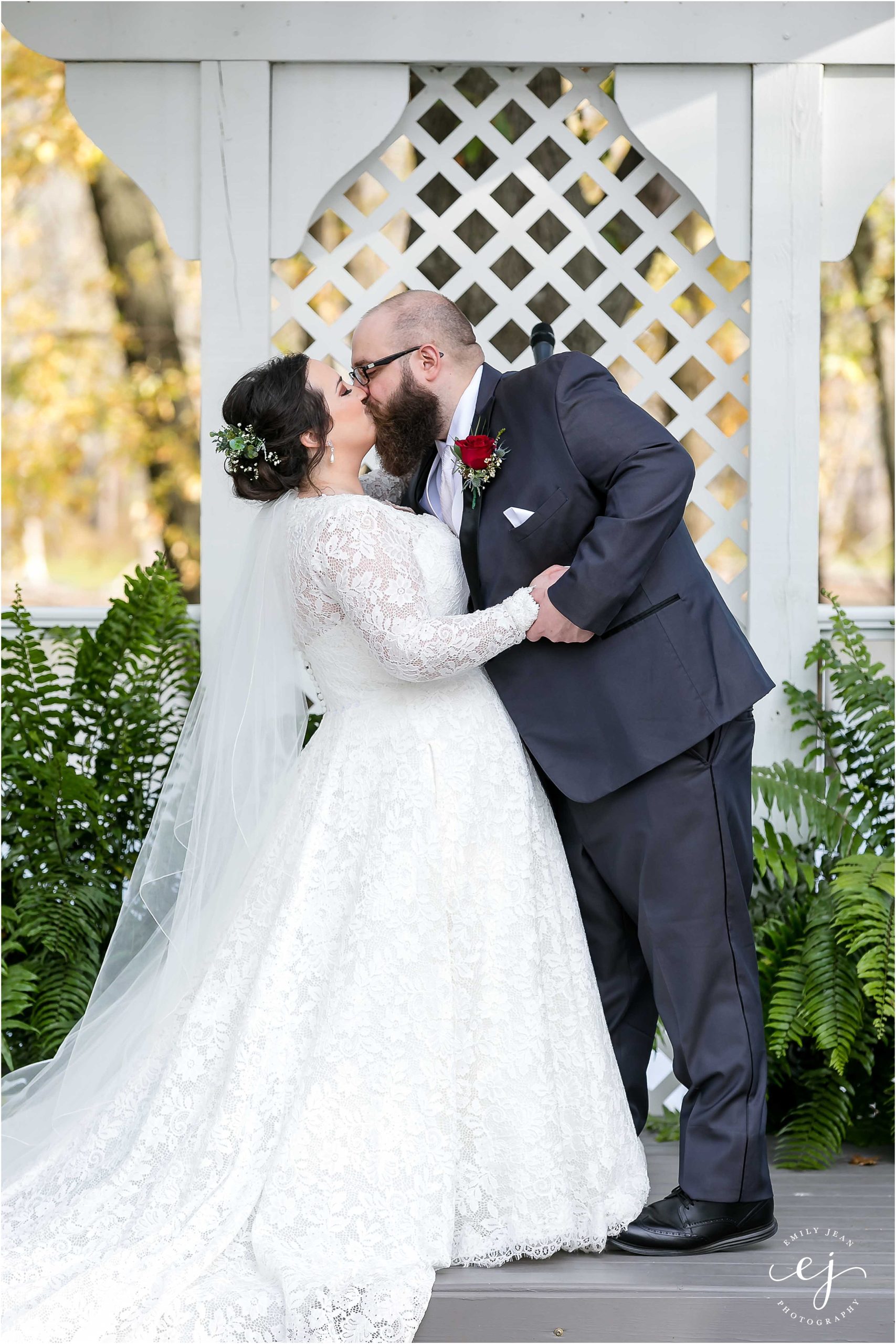 first kiss as husband and wife at outdoor ceremony