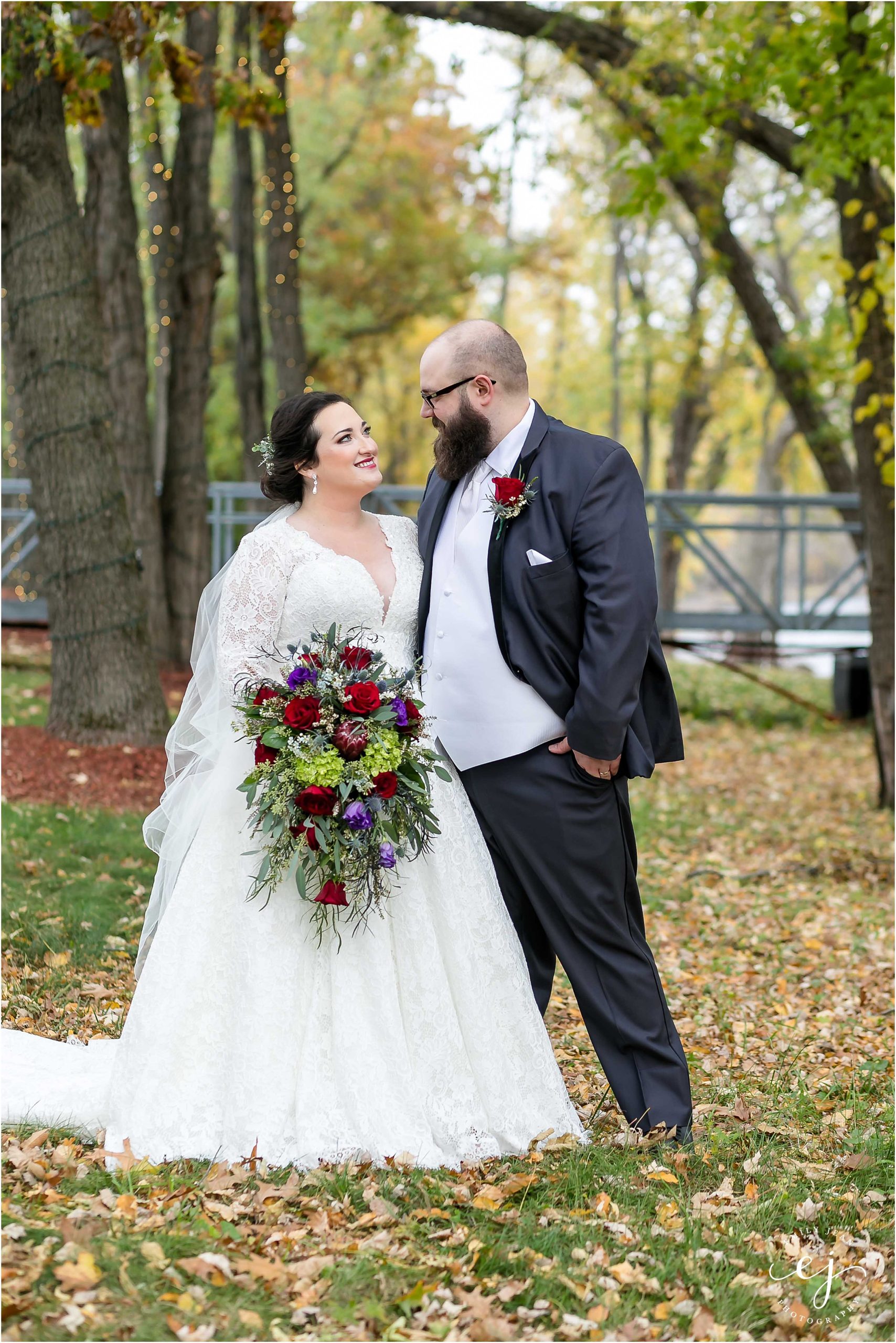 wisconsin fall wedding outside bride and groom snuggle
