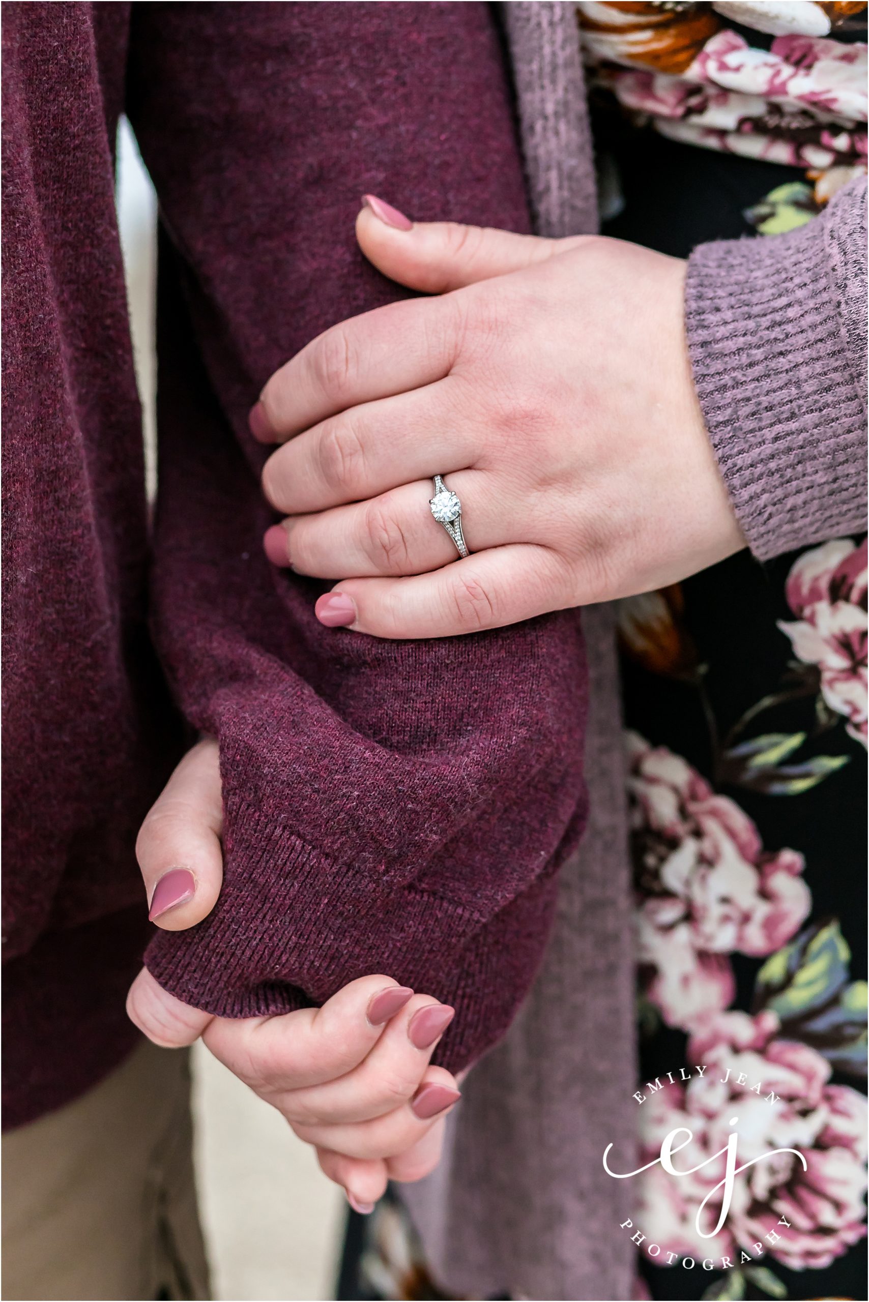 couple holding hands photo of engagement ring wearing mauve with nails done