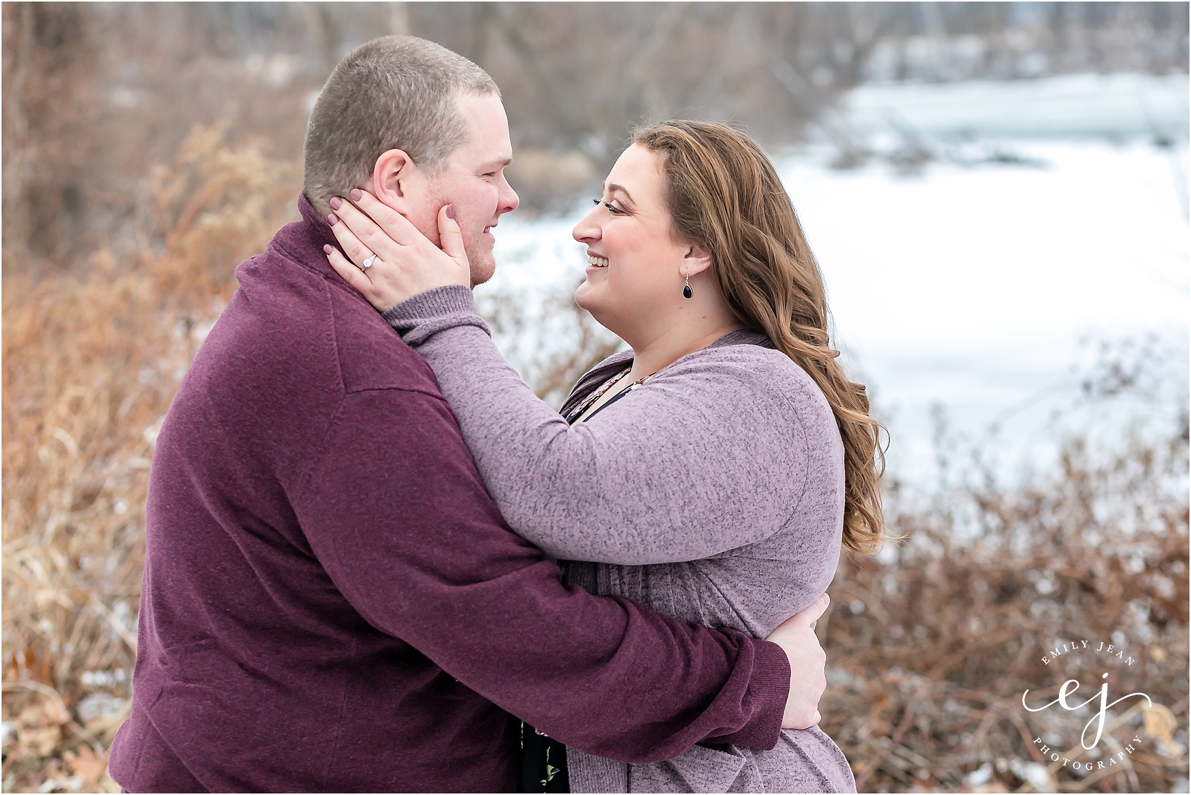 couple standing in snow engagement session wisconsin plus size couple