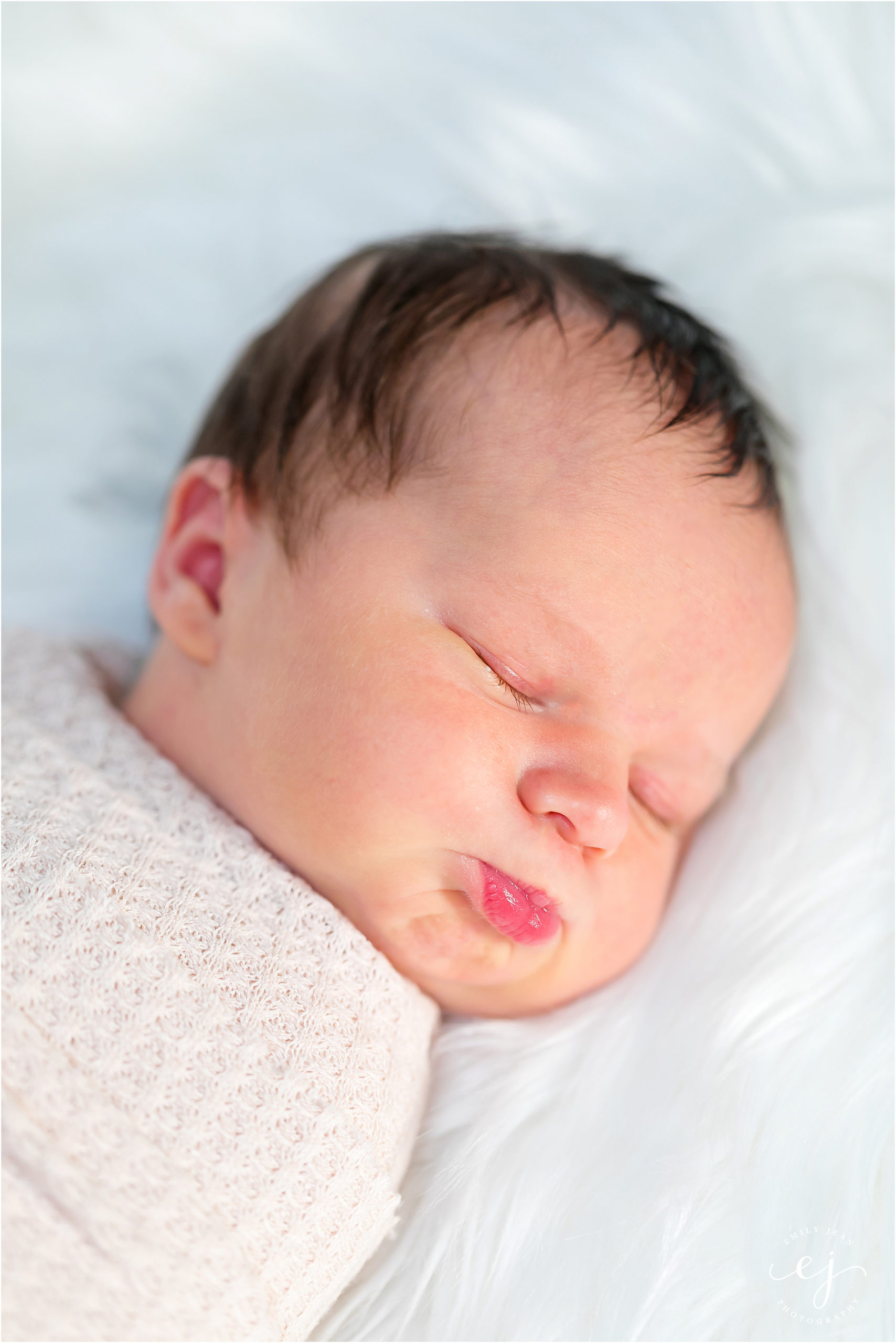 newborn baby making kissy face professional photography