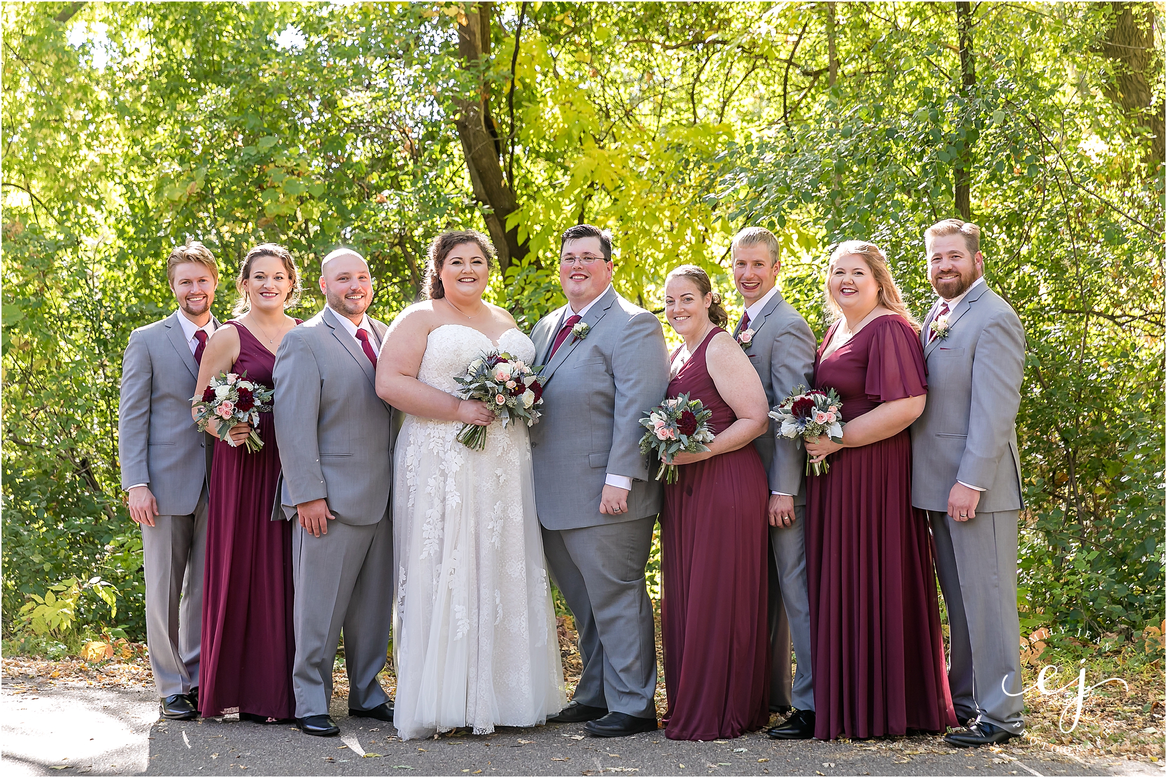 bridal party wedding photo standing with burgundy and light grey