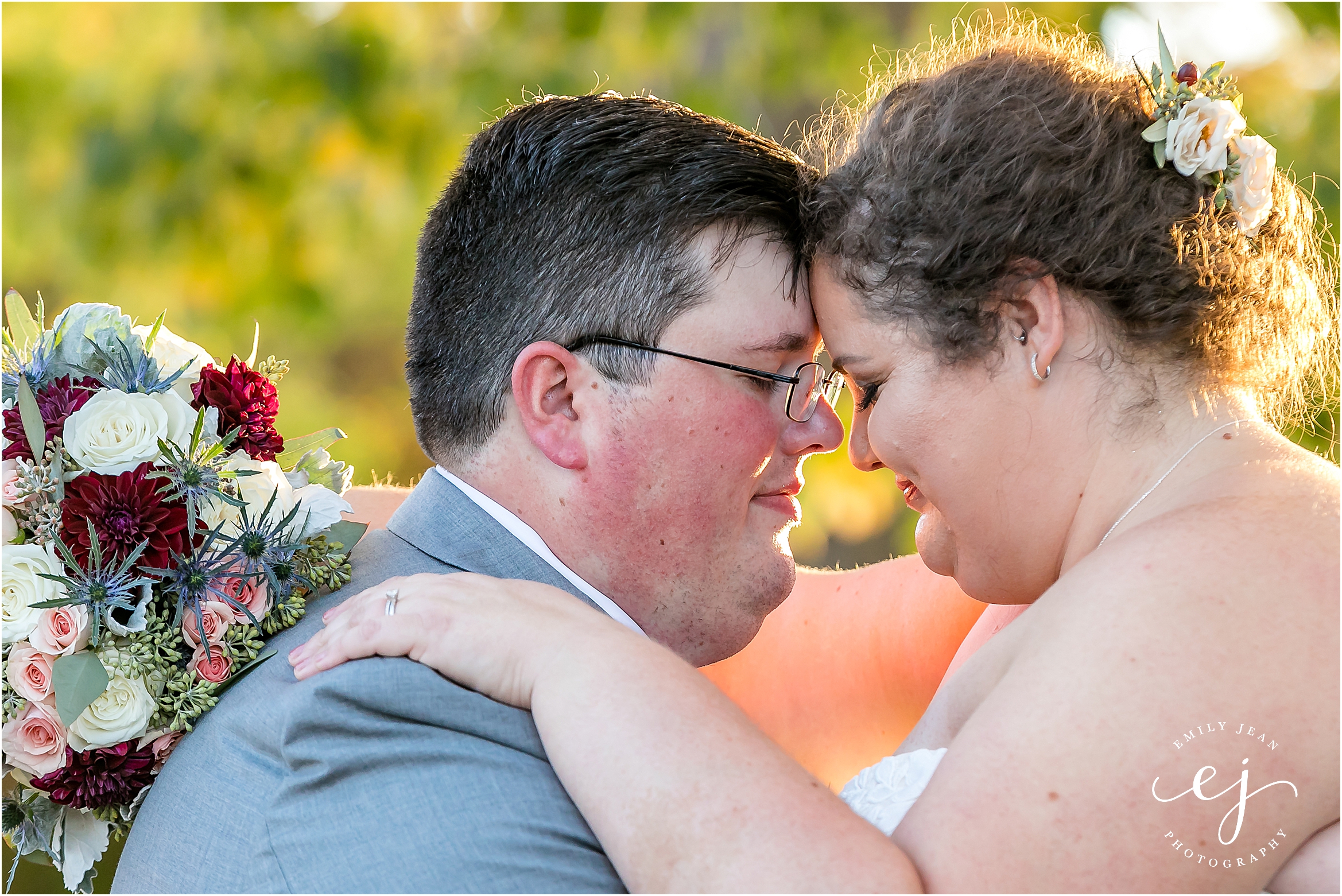 bride and groom heads together with sunset eyes closed romantic