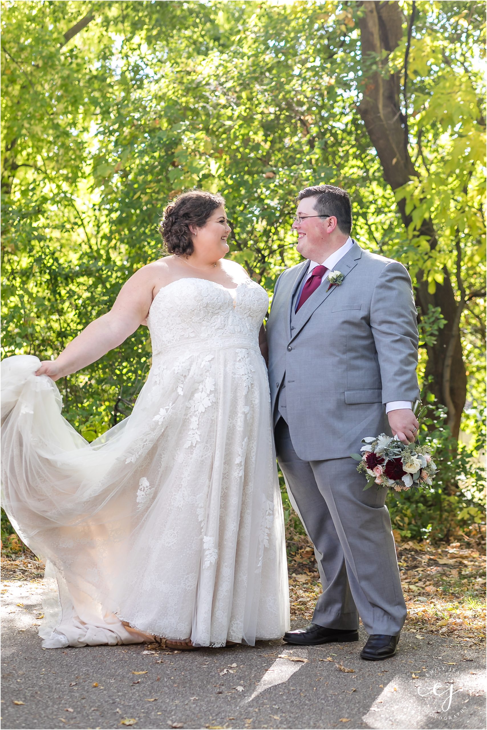 bride twirling her plus size wedding dress with sweetheart neckline and lace