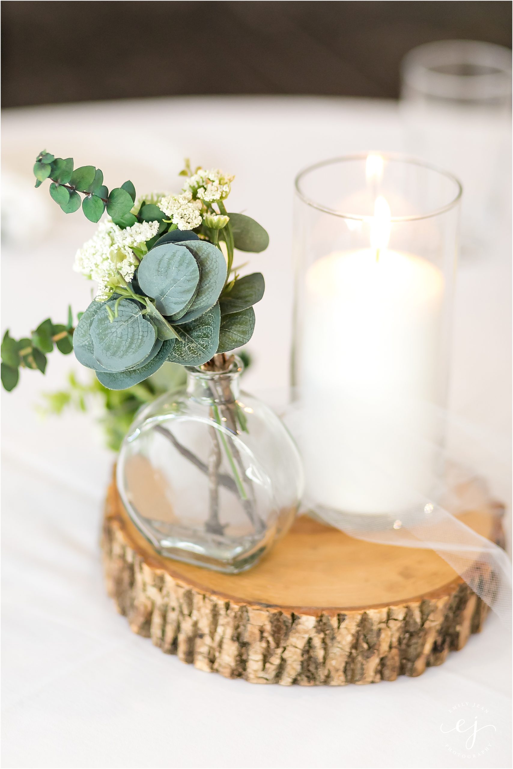 simple rustic table centerpiece with greenery in glass jar