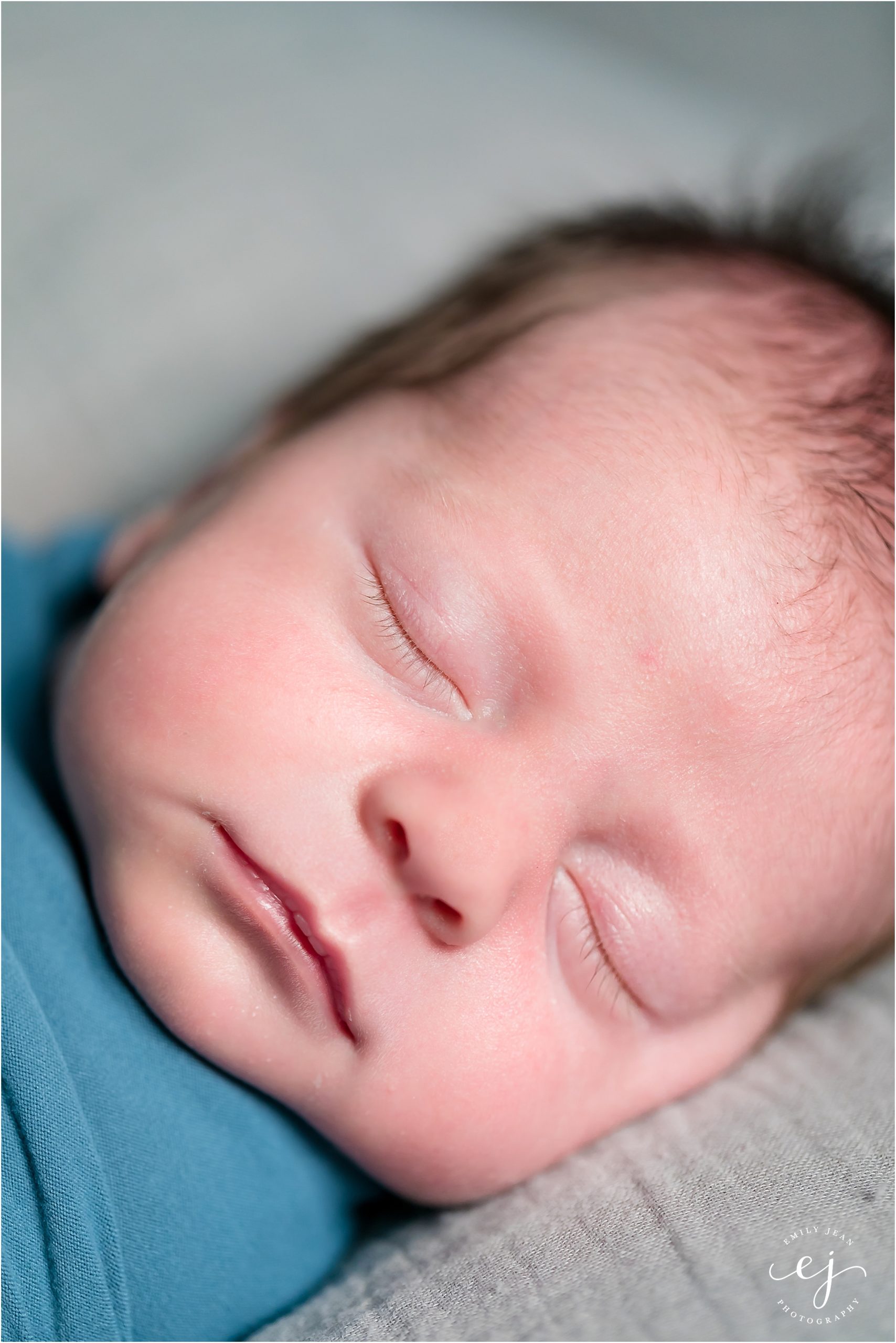 la crosse wisconsin family photo newborn baby boy swaddled in blue