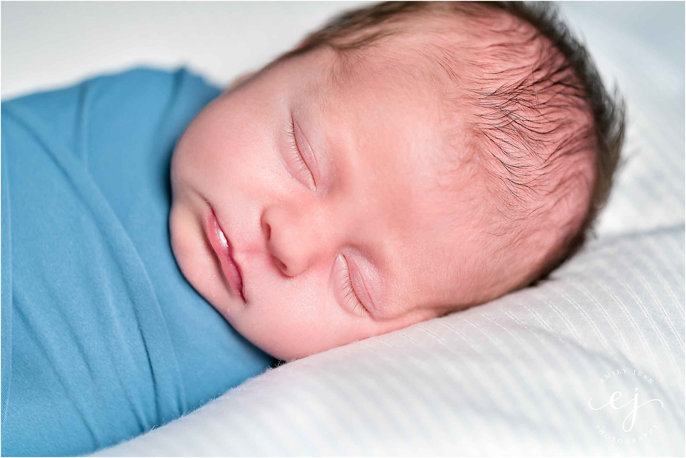 la crosse wisconsin family photo newborn baby boy swaddled in blue