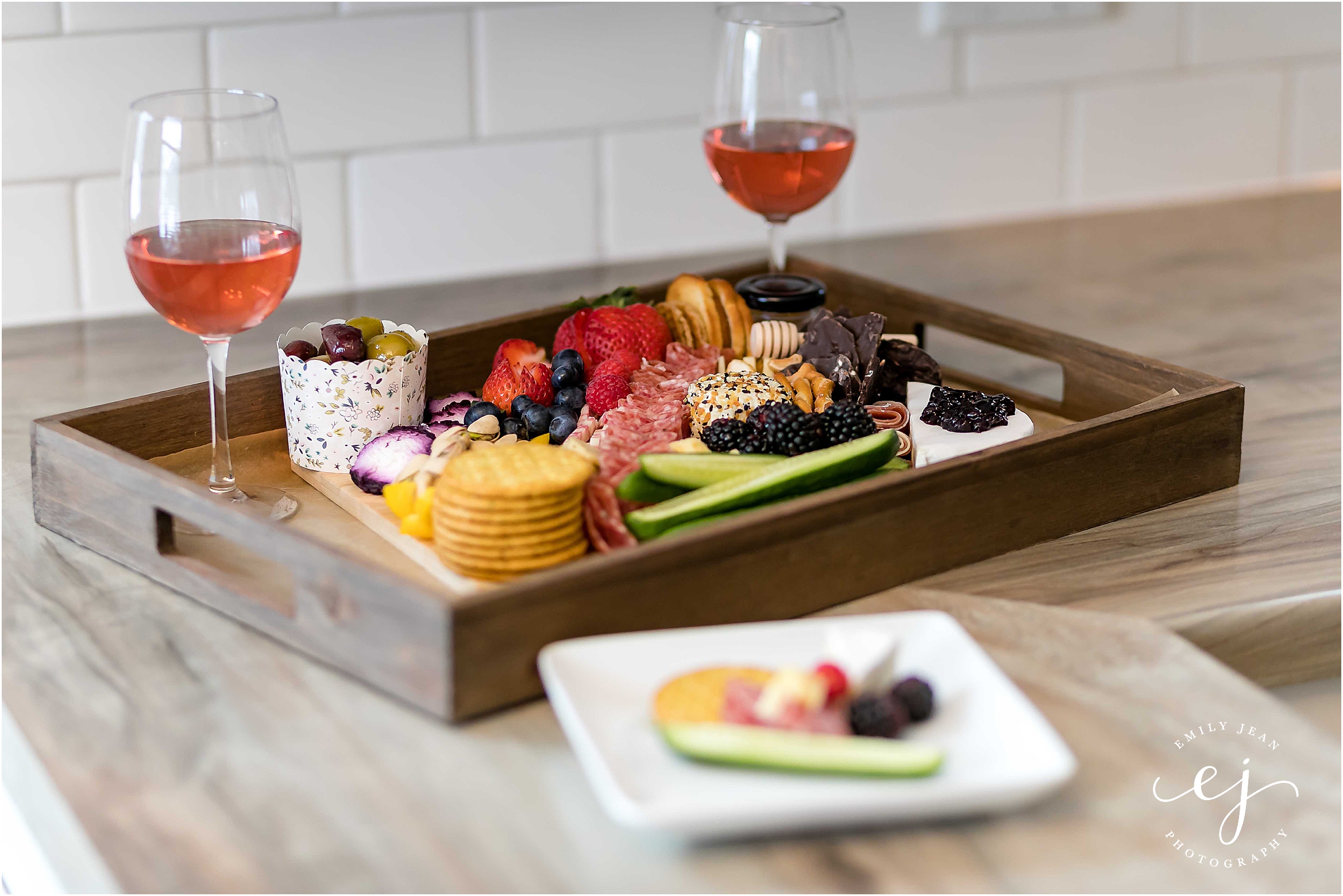 la crosse grazing board with fruit meat cheese and vegetables with wine