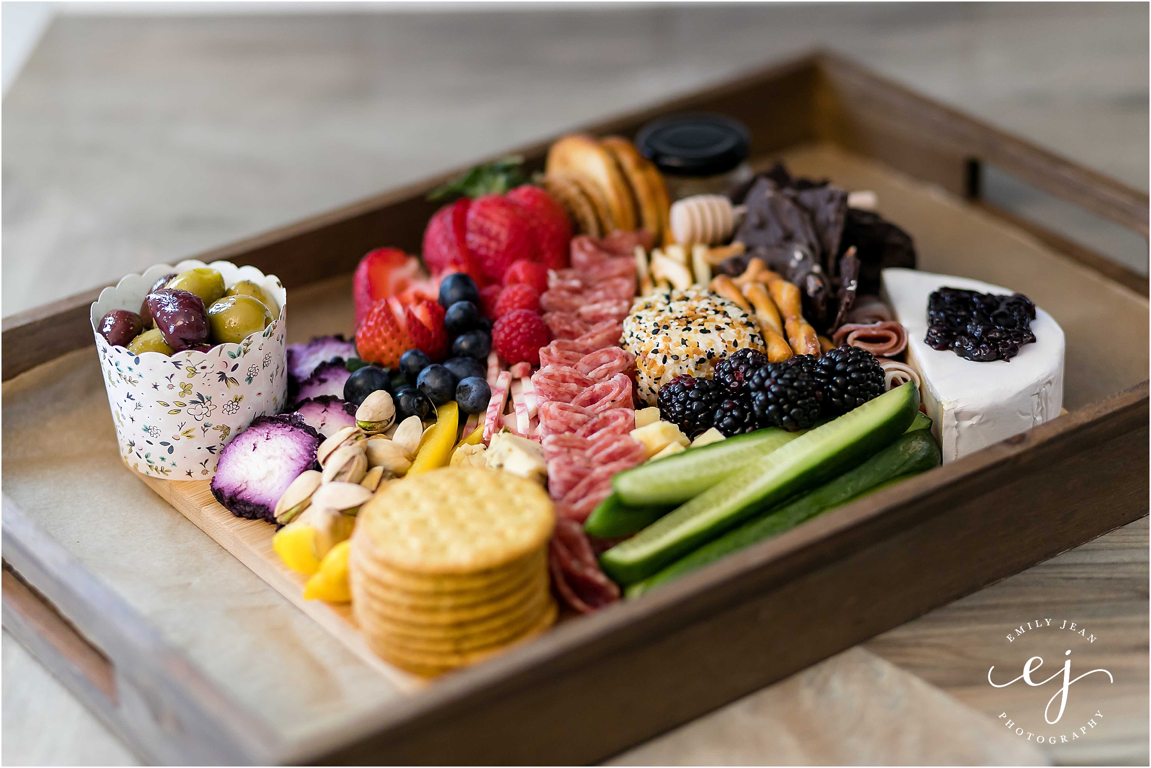 colorful charcuterie grazing board with meat cheese vegetables and fruit perfect for group