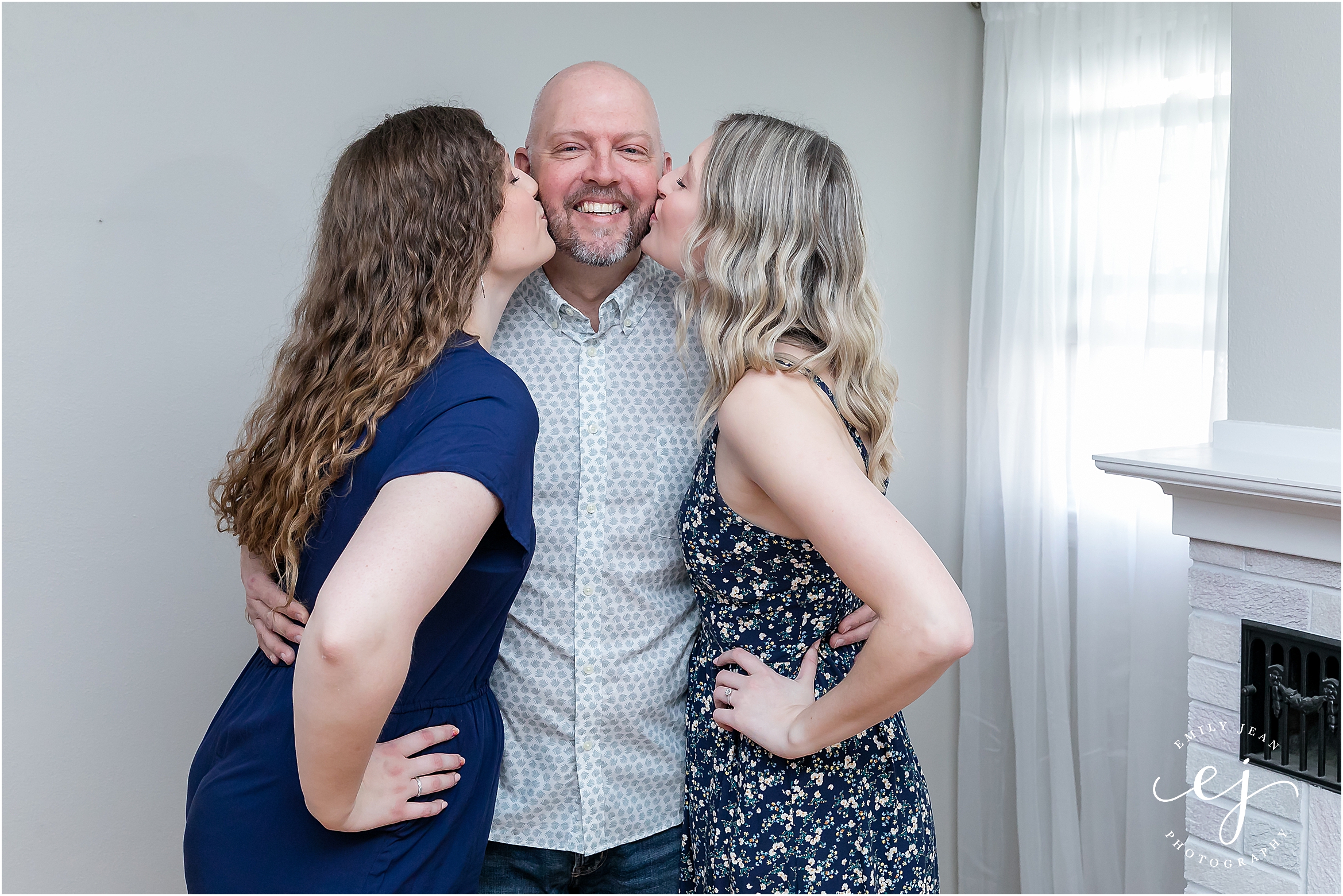 Adult daughters kissing their dad on the cheek La Crosse Wisconsin family portraits