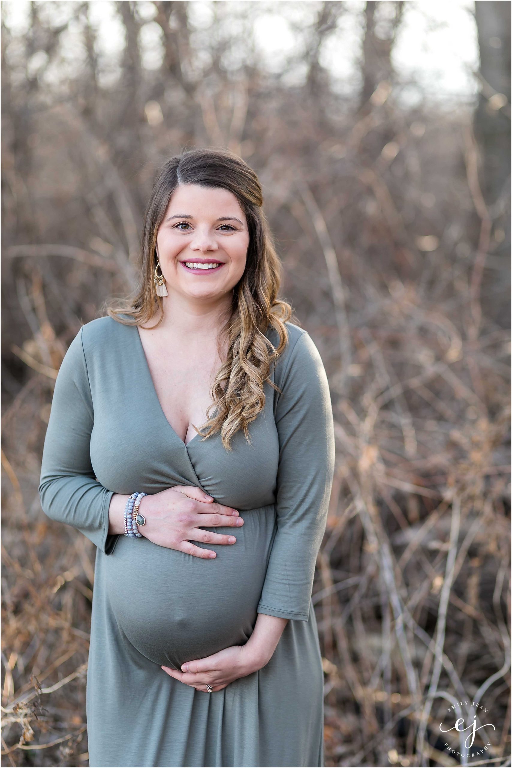 pregnant woman in green dress professional maternity session