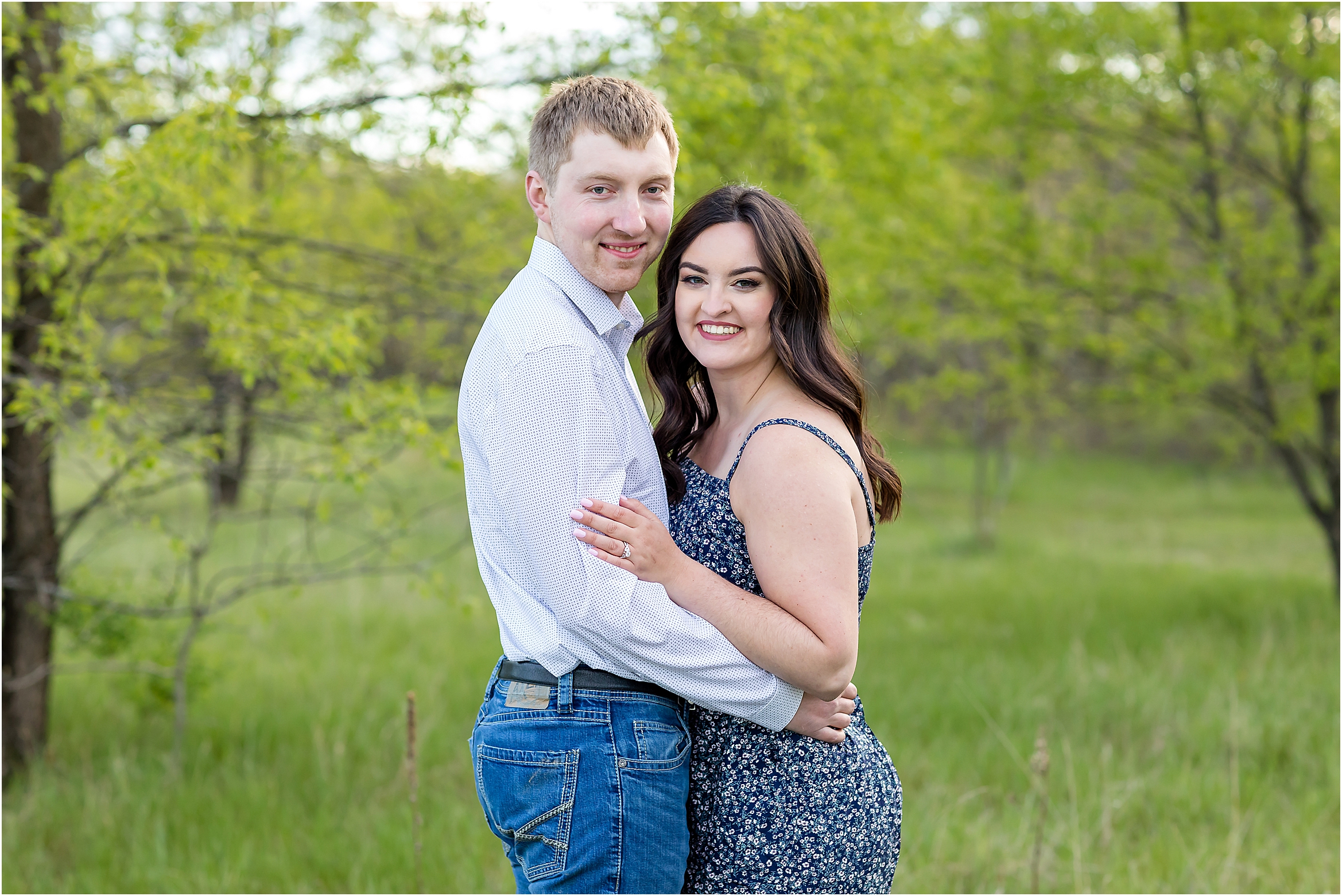 park engagement session smiling at camera