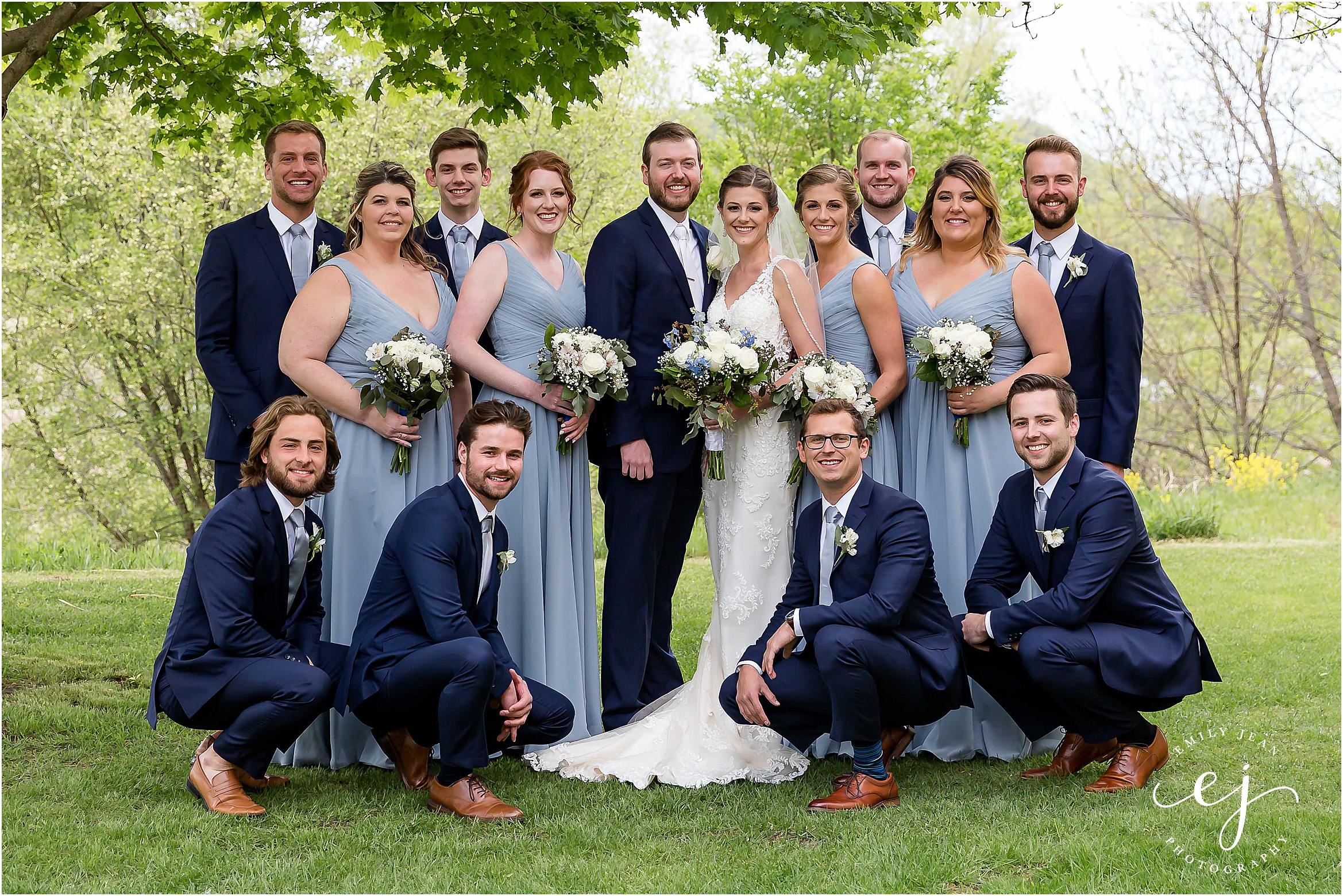 bridal wedding party wearing navy and dusty blue