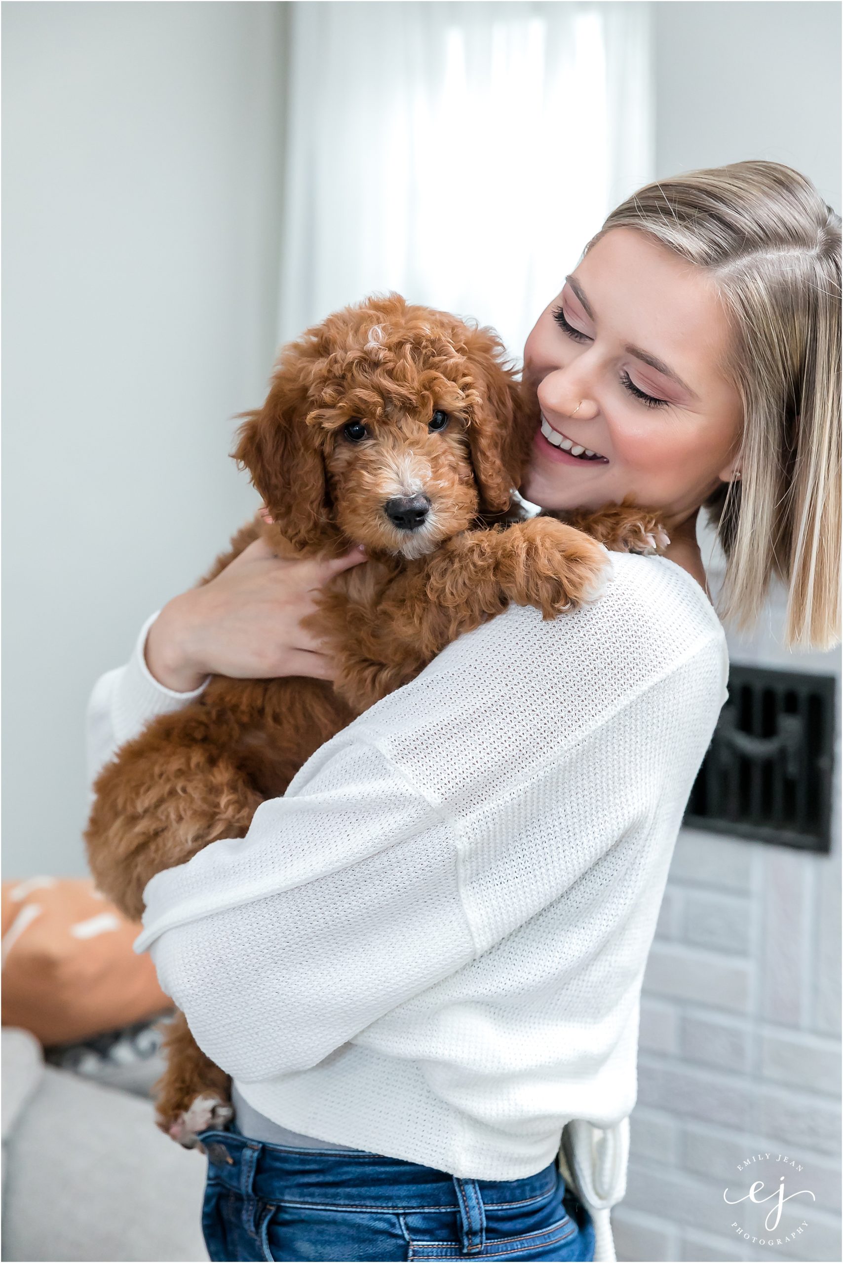 at home family photos with puppy golden doodle
