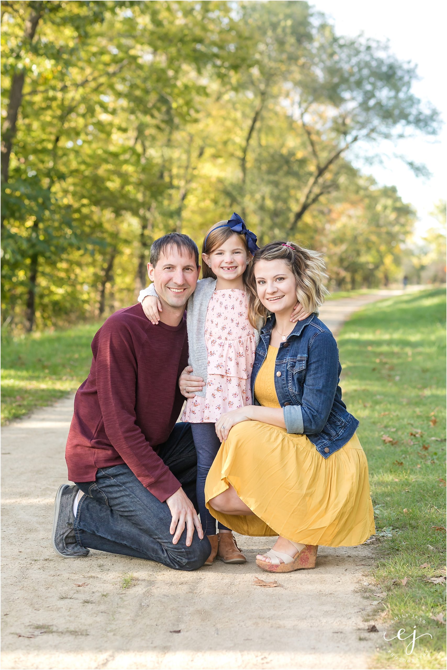 family photos on trail in late summer wisconsin burgundy navy and yellow