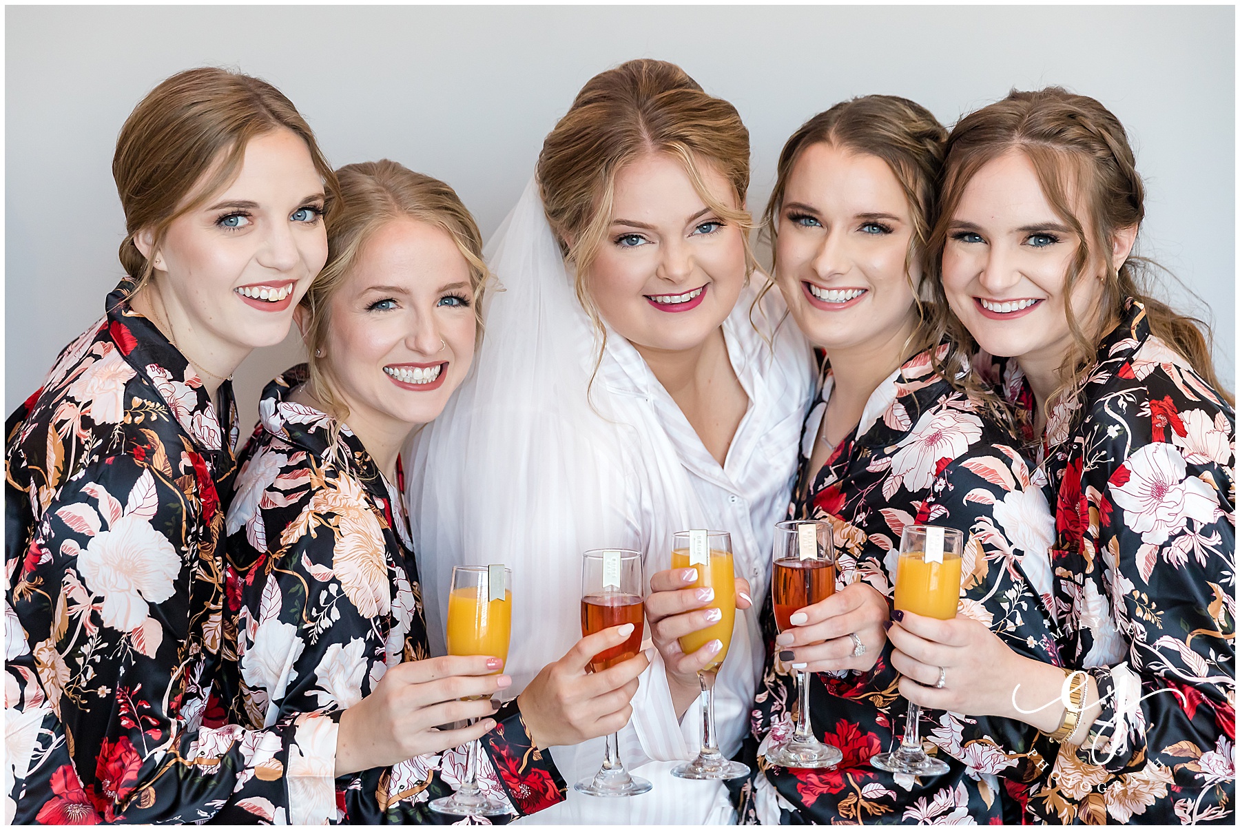 bride and bridesmaids mimosas celebrations on the river bridal suite