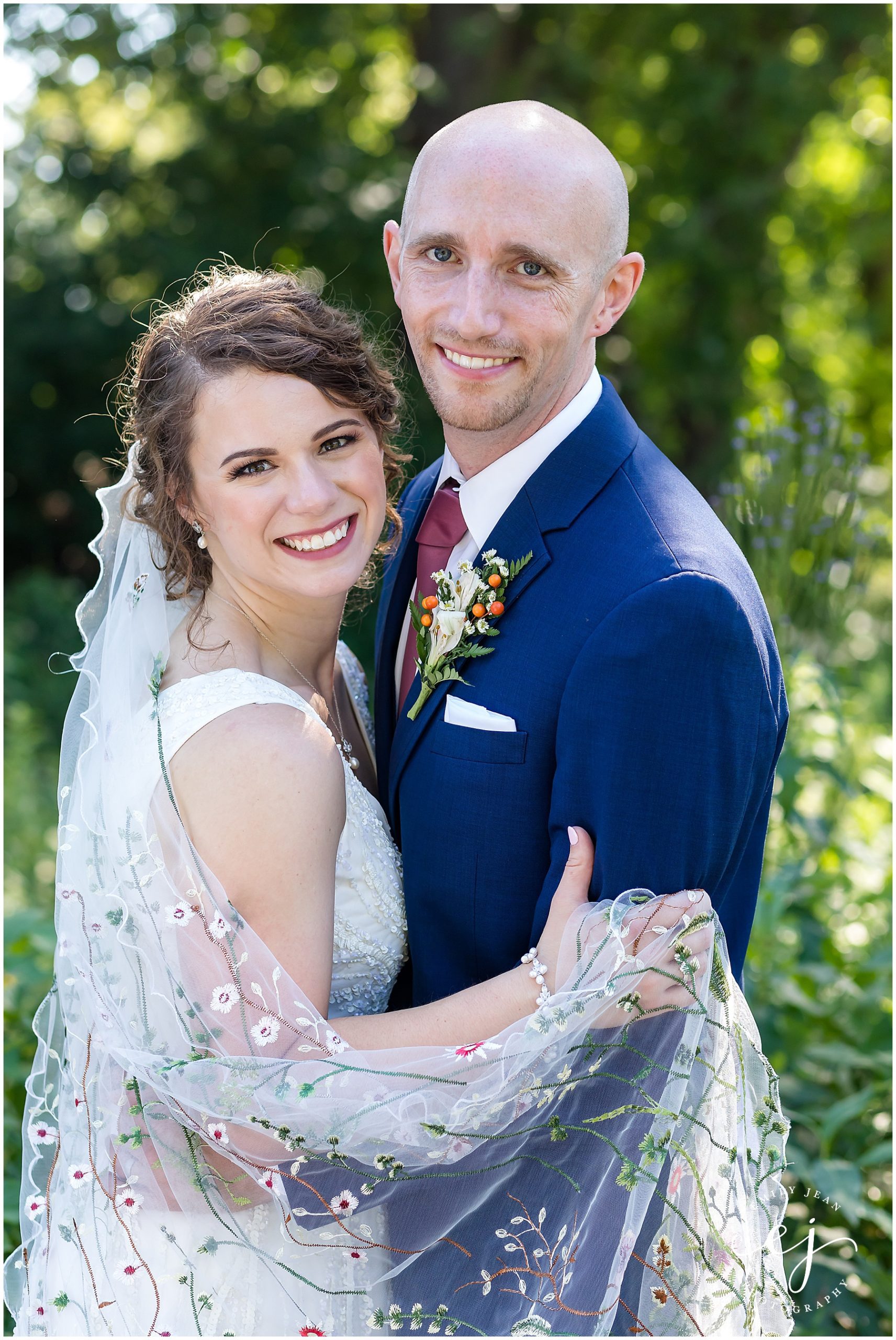 floral veil bride and groom