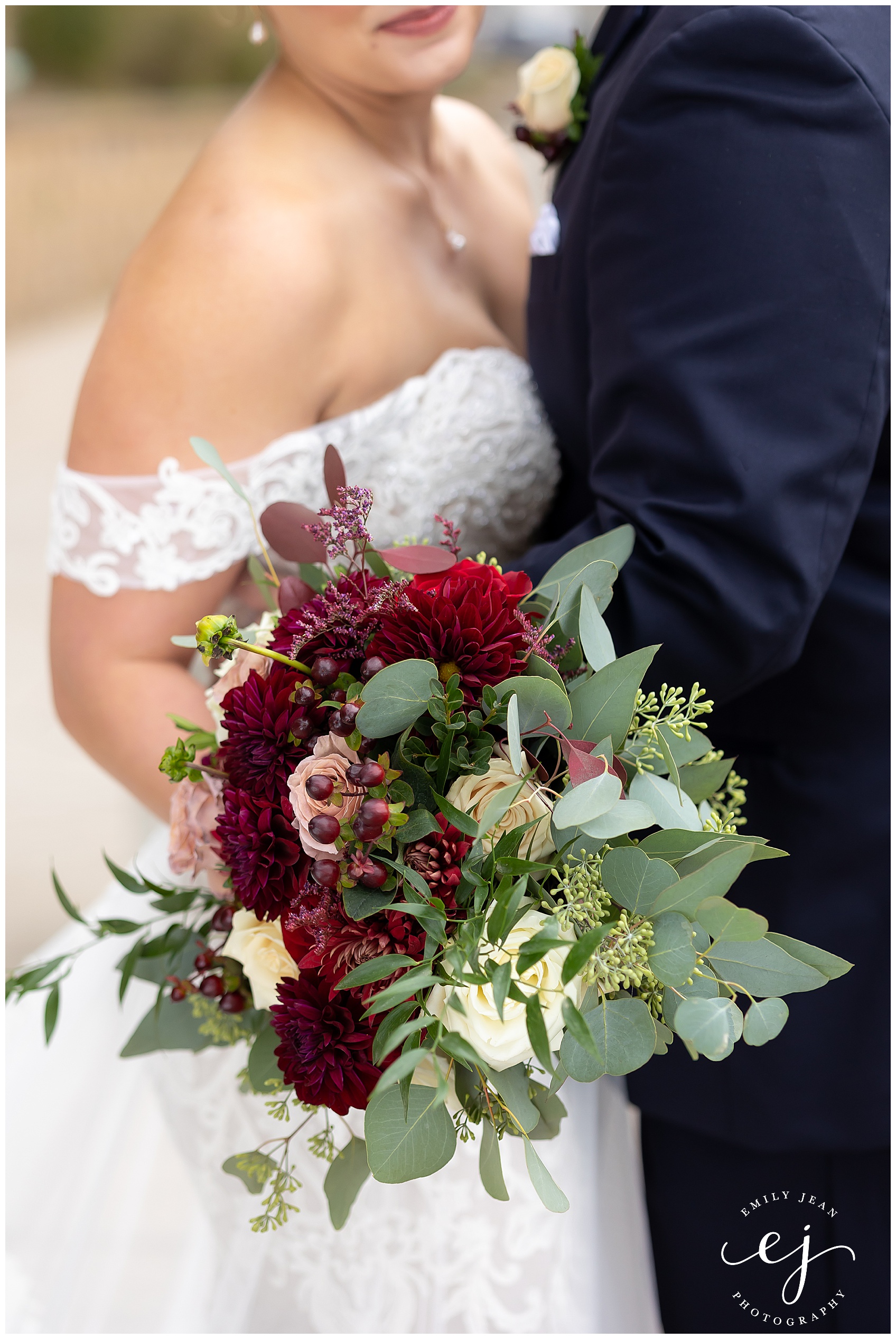 up close photo of burgundy and red wedding bouquet