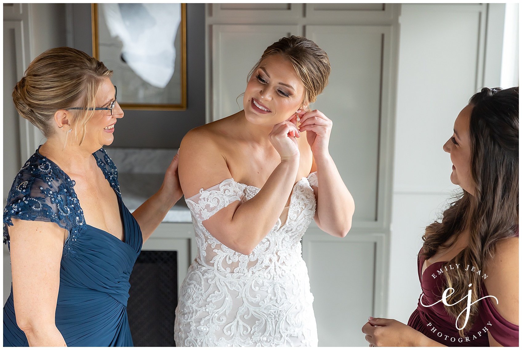 bride with mom and maid of honor getting ready with lace dress at the charmant hotel la crosse wisconsin