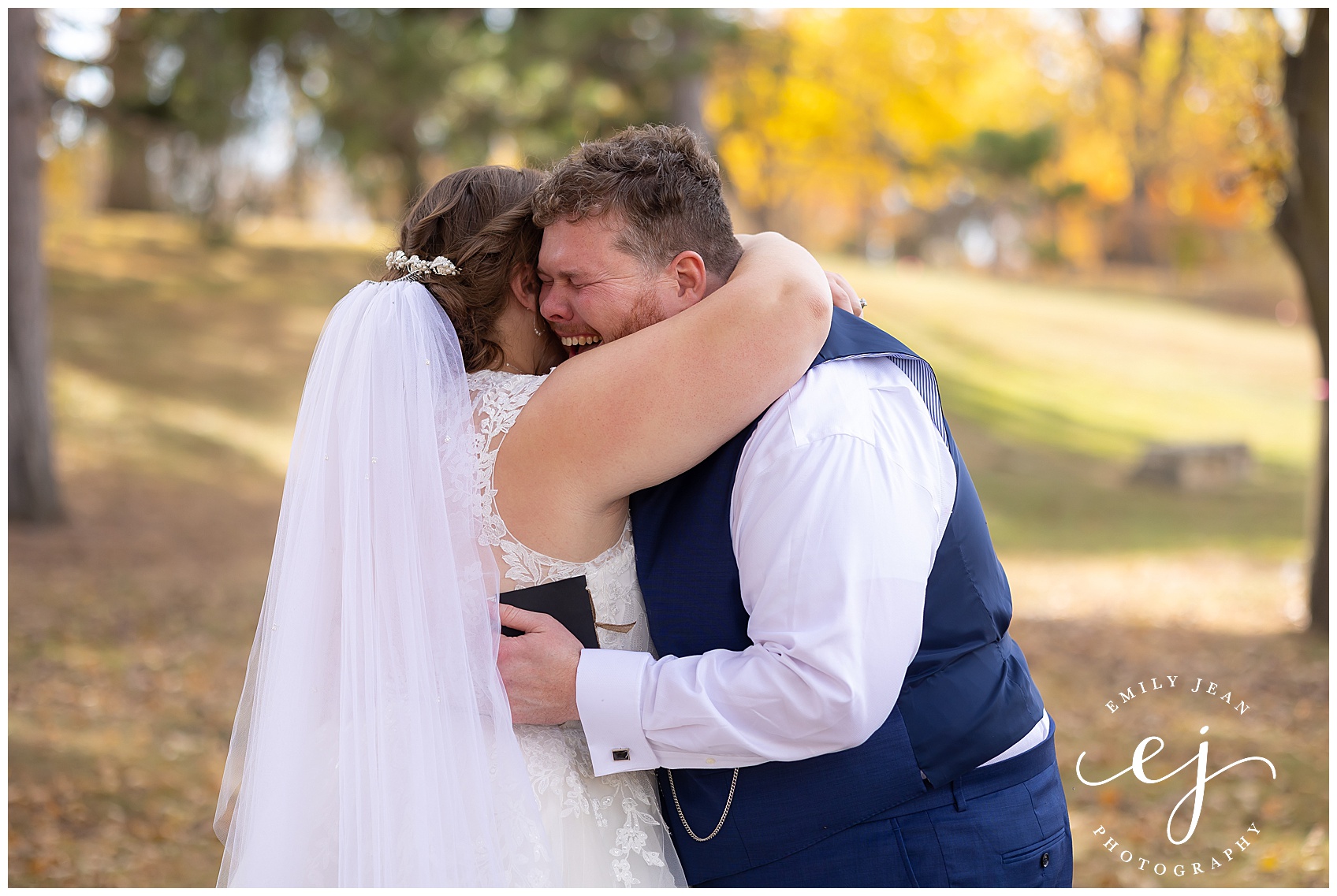 bride and groom crying and hugging after reading vows