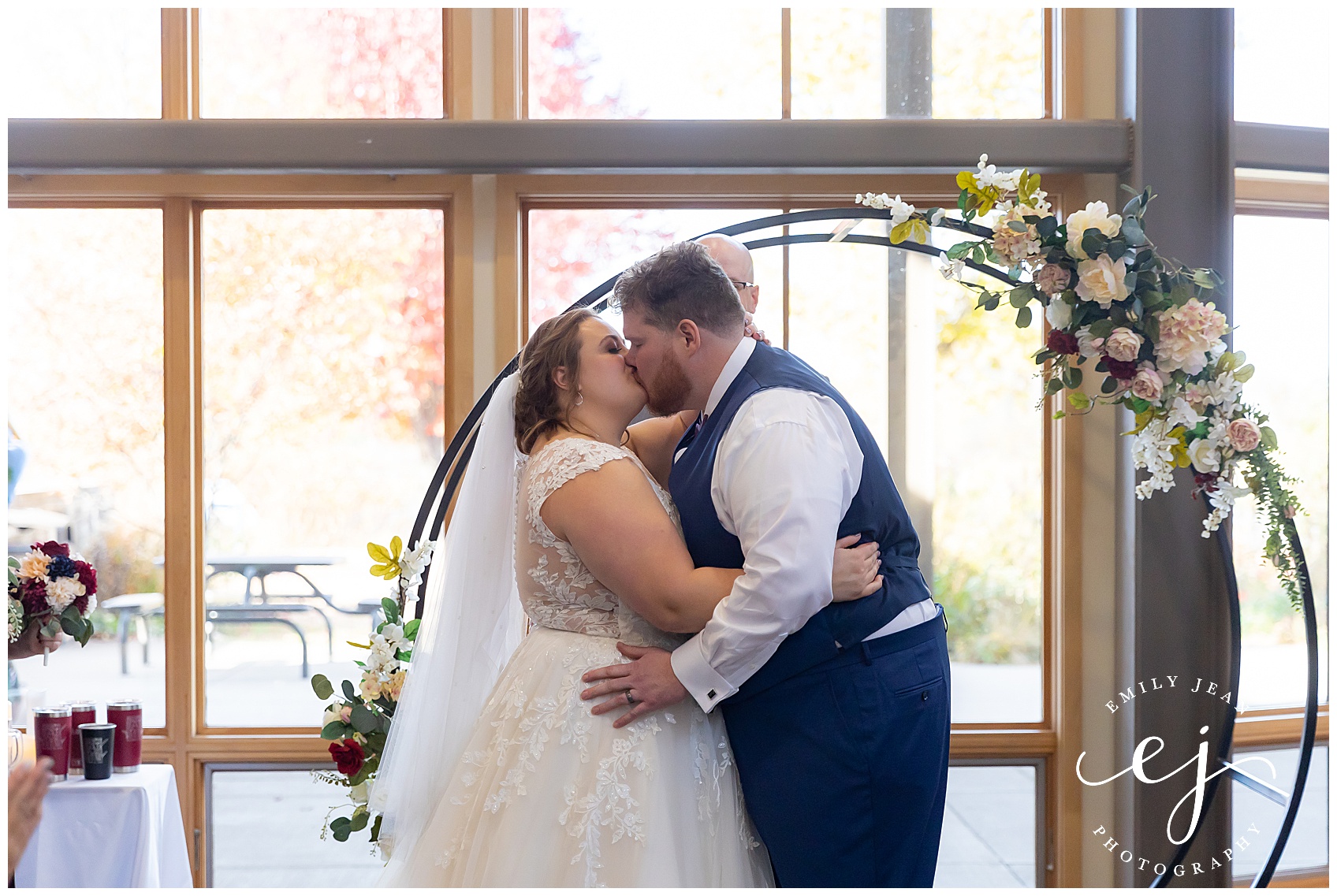 first kiss at indoor wedding