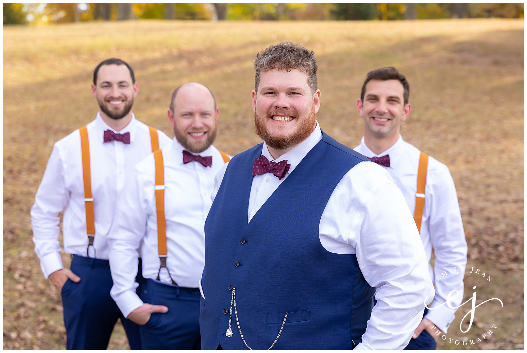 navy blue wedding with suspenders groomsmen