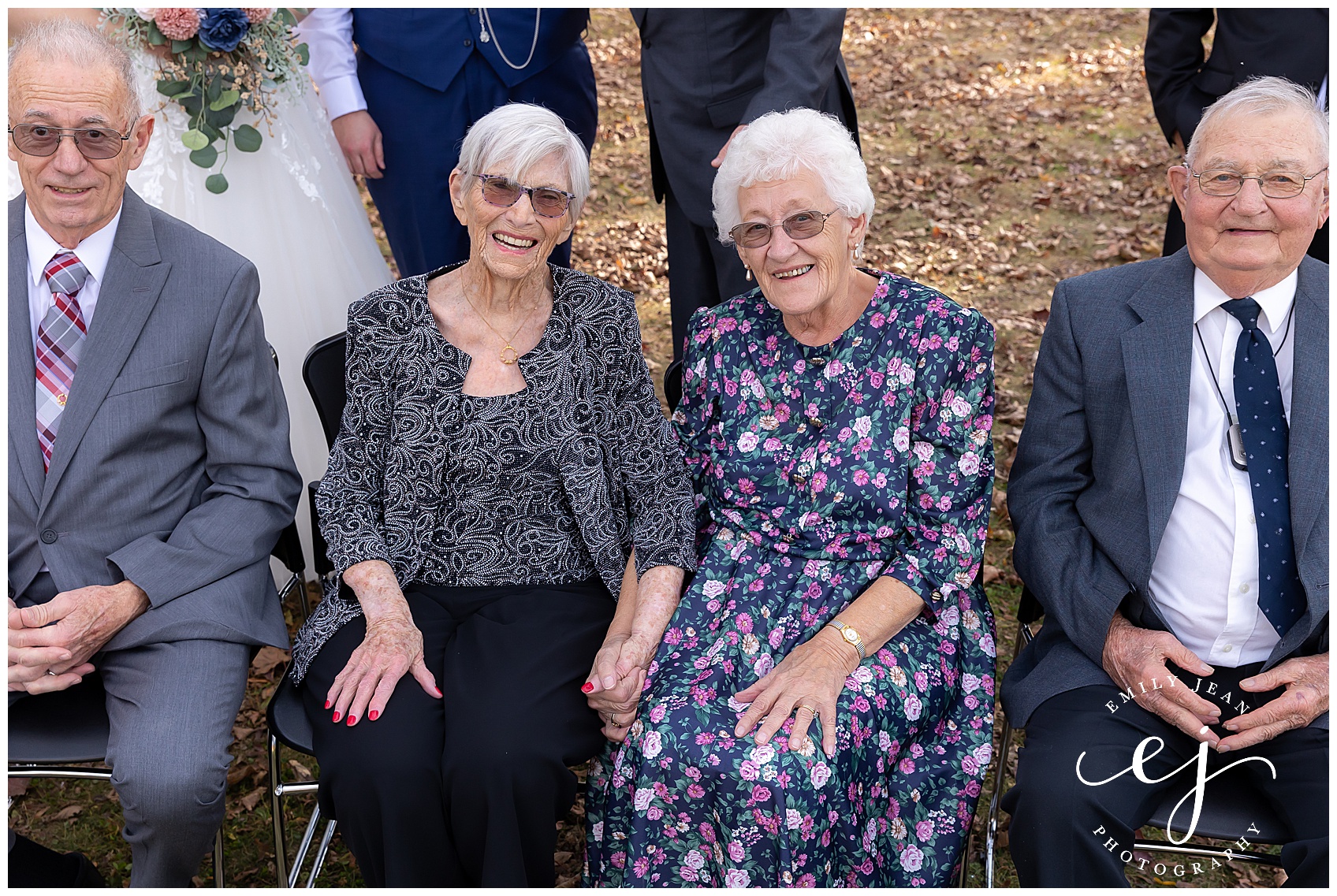 grandmas holding hands during family photos