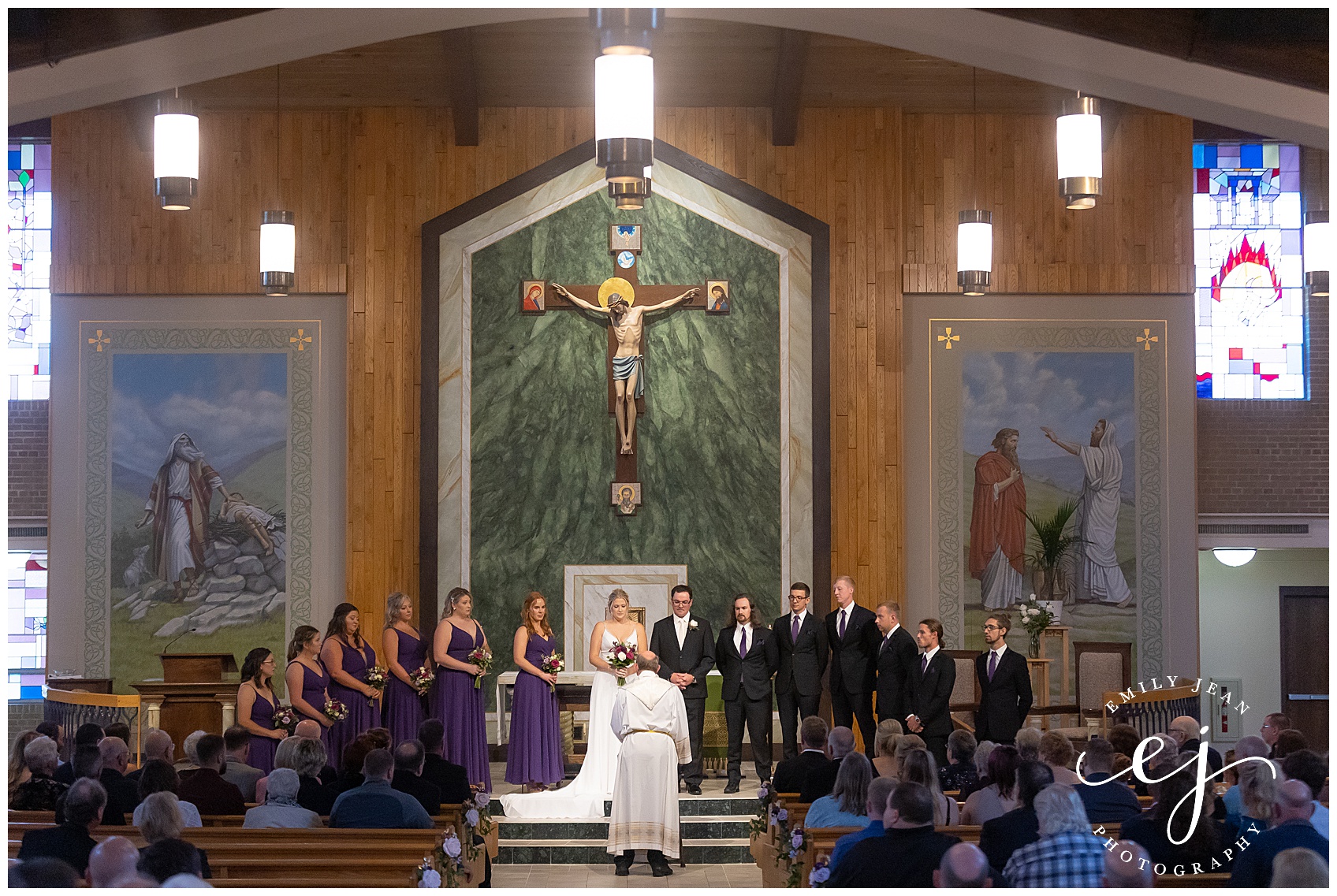 bridesmaids and groomsmen standing in front of church catholic ceremony