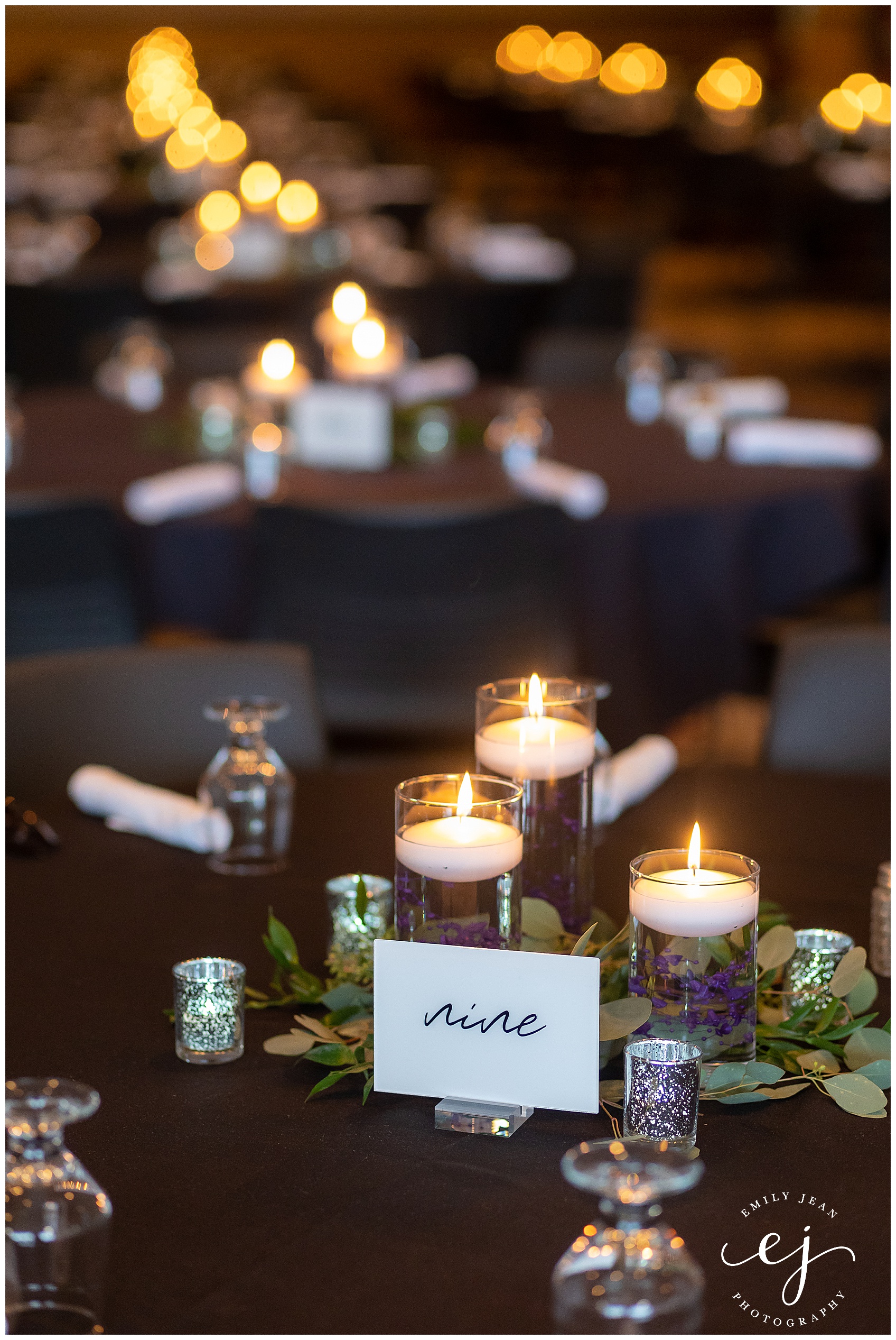 candle centerpiece on black table cloth