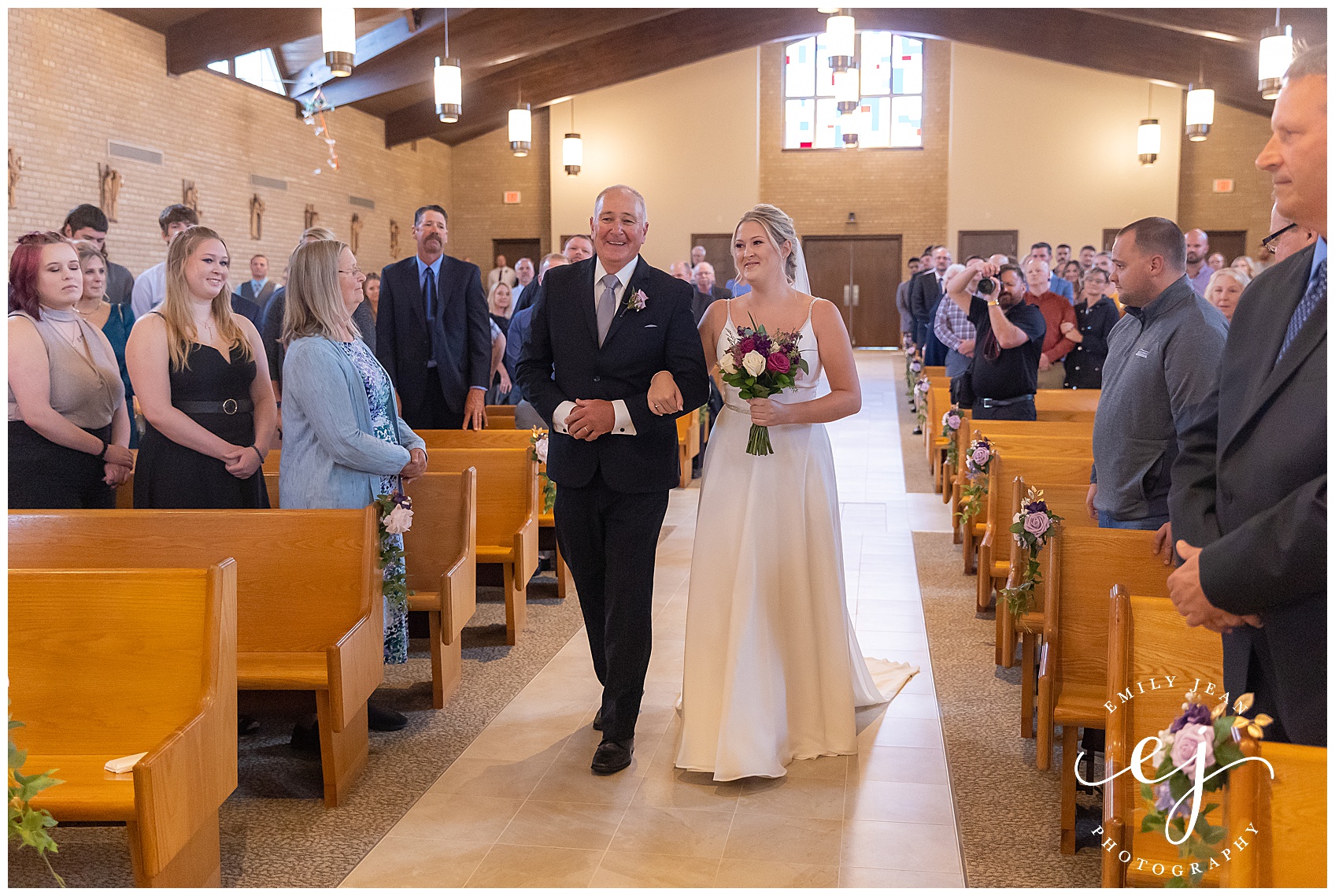 bride walking down the aisle with her dad at St. Pat's Onalaska