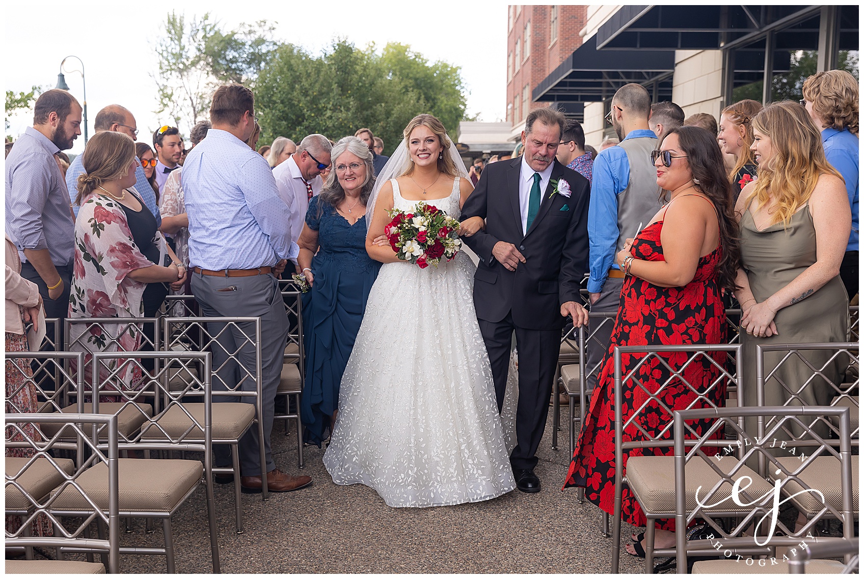 bride walking down the aisle at the cargill room outdoors