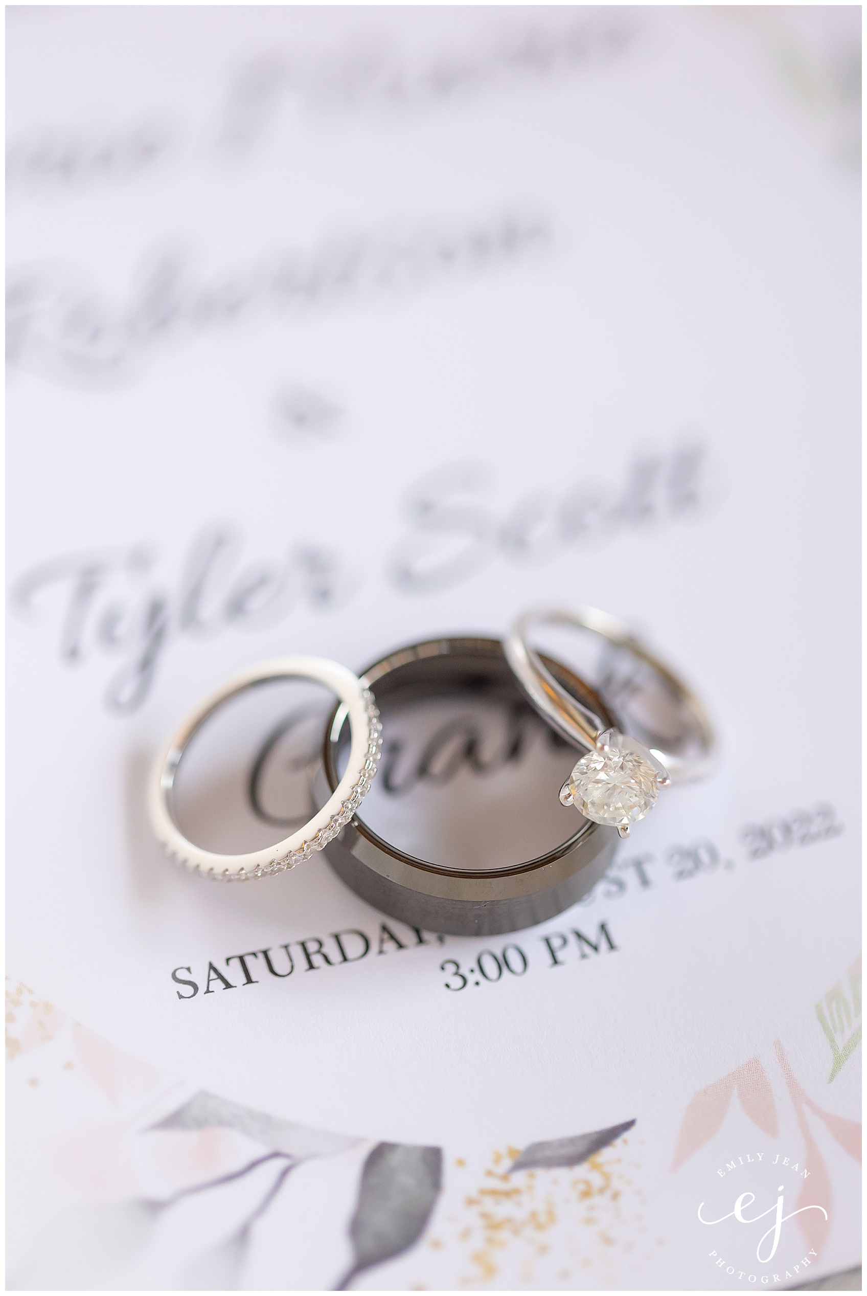 rings on an invitation at the waterfront