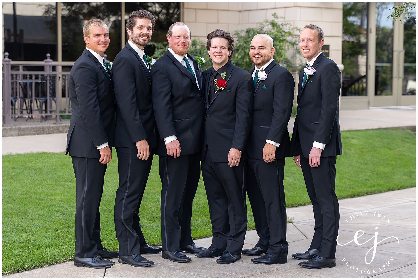 black tie groomsmen with rose boutonnieres 