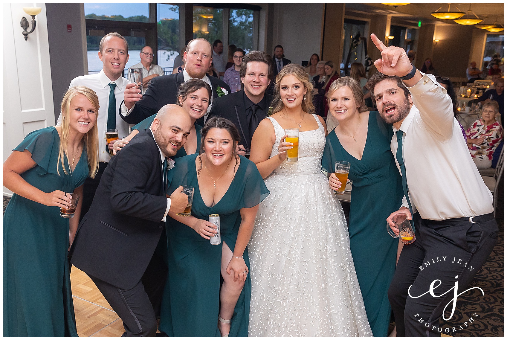 Bridal party, enjoying, beers, and smiling at the recept