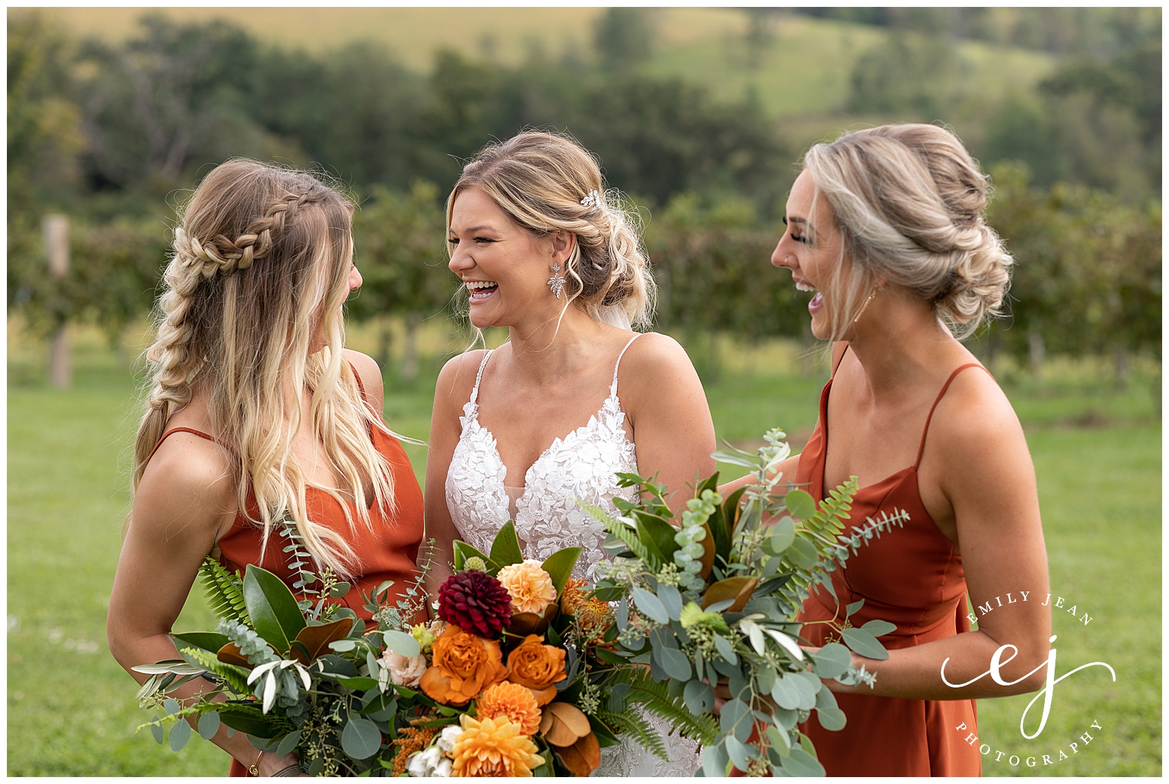 bride with her gorgeous maids of honor laughing