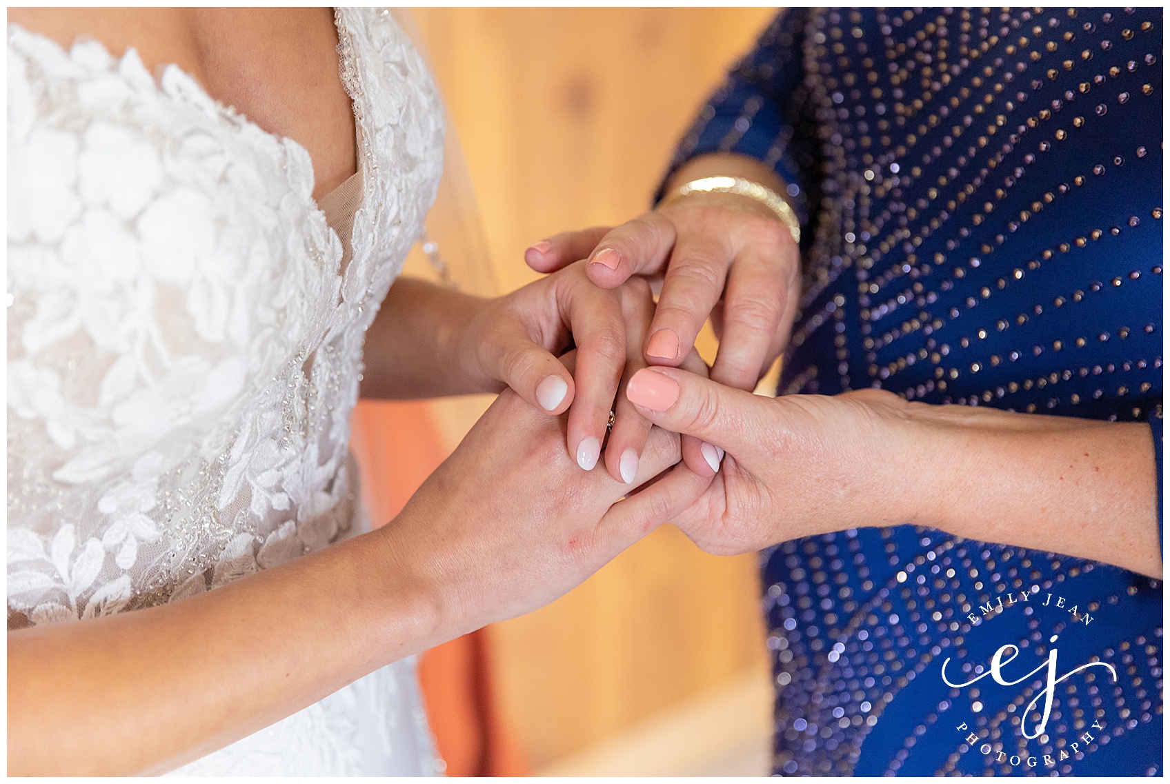 mom and daughter holding hands on wedding date